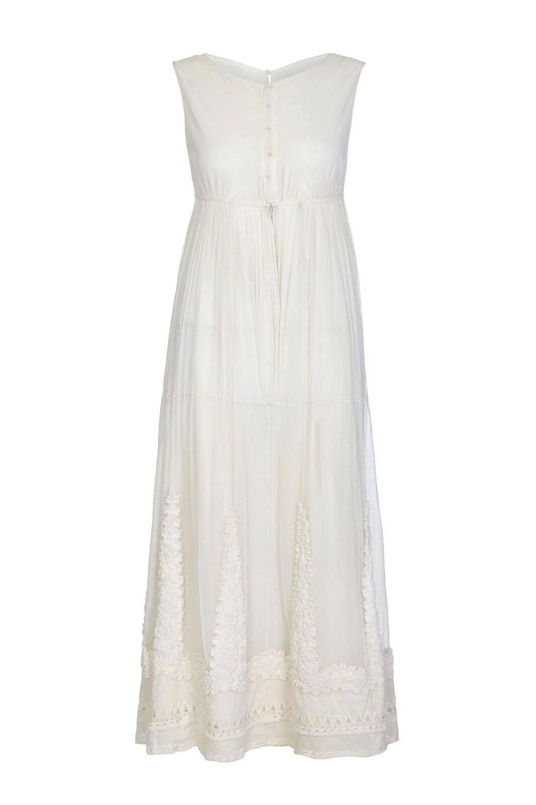 This enchanting Edwardian/Belle Epoque era antique bridal dress and matching tunic are in remarkable antique vintage condition and have been lovingly hand embroidered and knotted in extraordinary detail. The style reminds me of a Ballet Russe