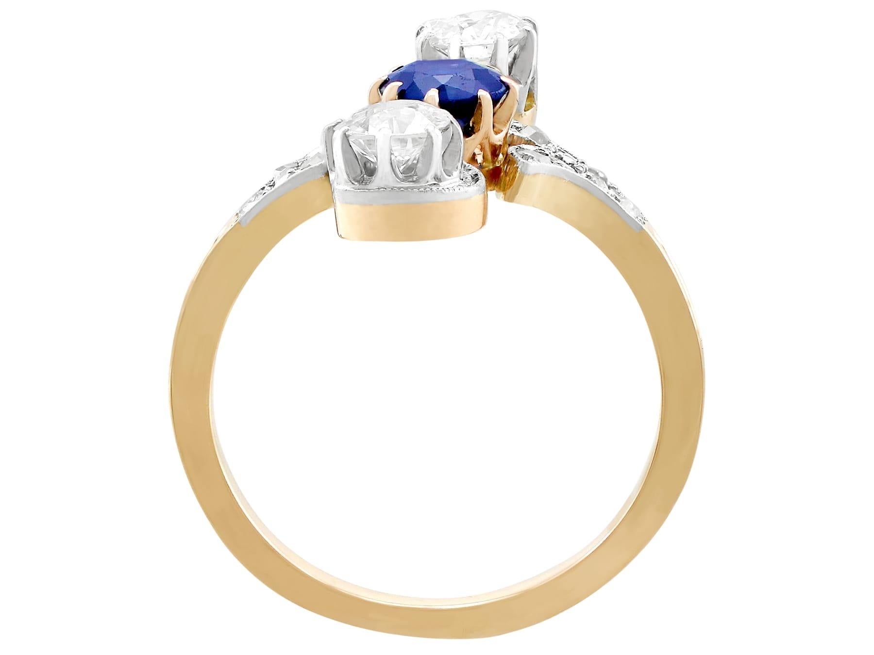 Round Cut 1910s Antique Sapphire and 1.21 Carat Diamond Yellow Gold Twist Ring For Sale