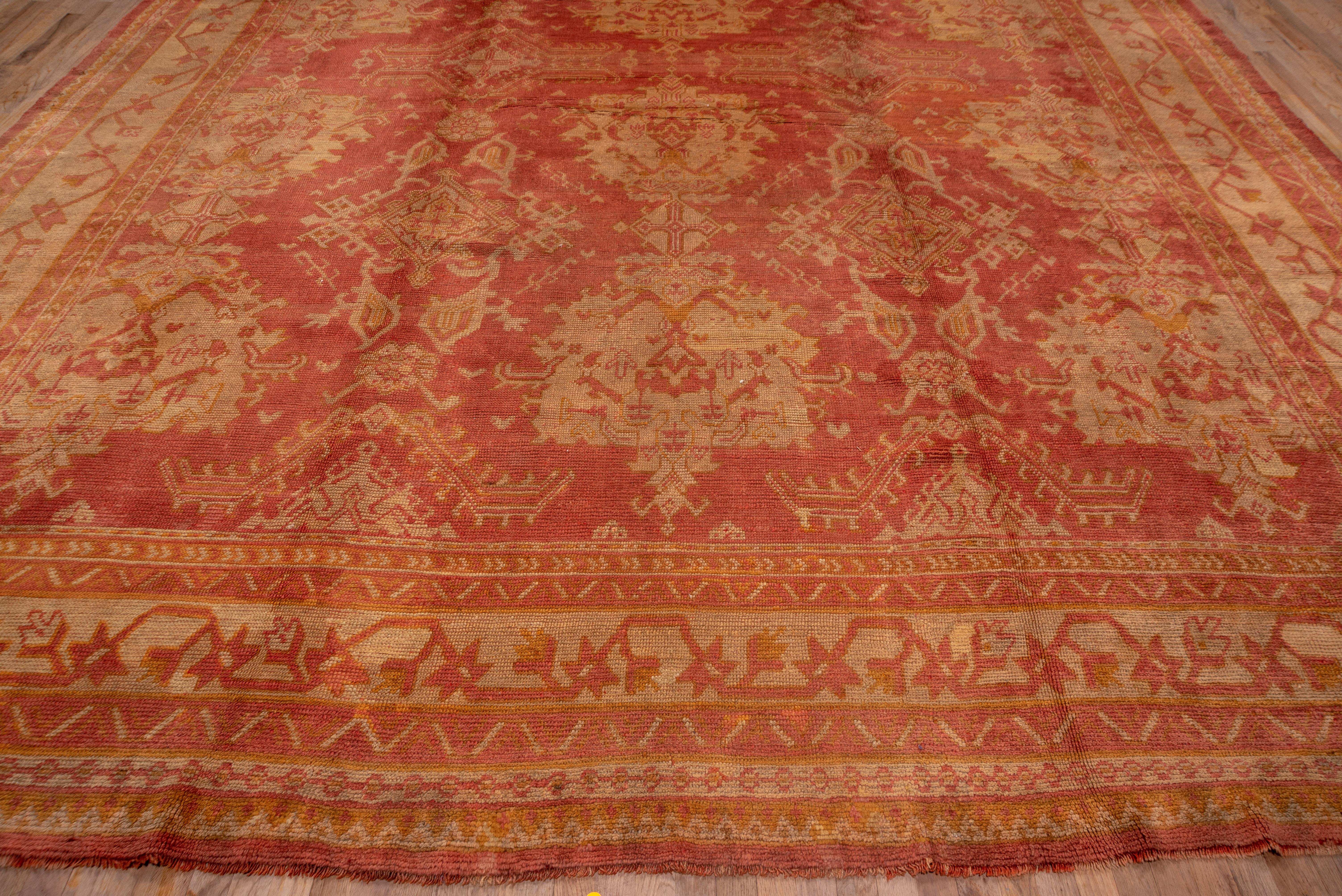 Wool 1910s Antique Turkish Oushak Area Rug, Light Red All-Over Field, Gold Borders For Sale