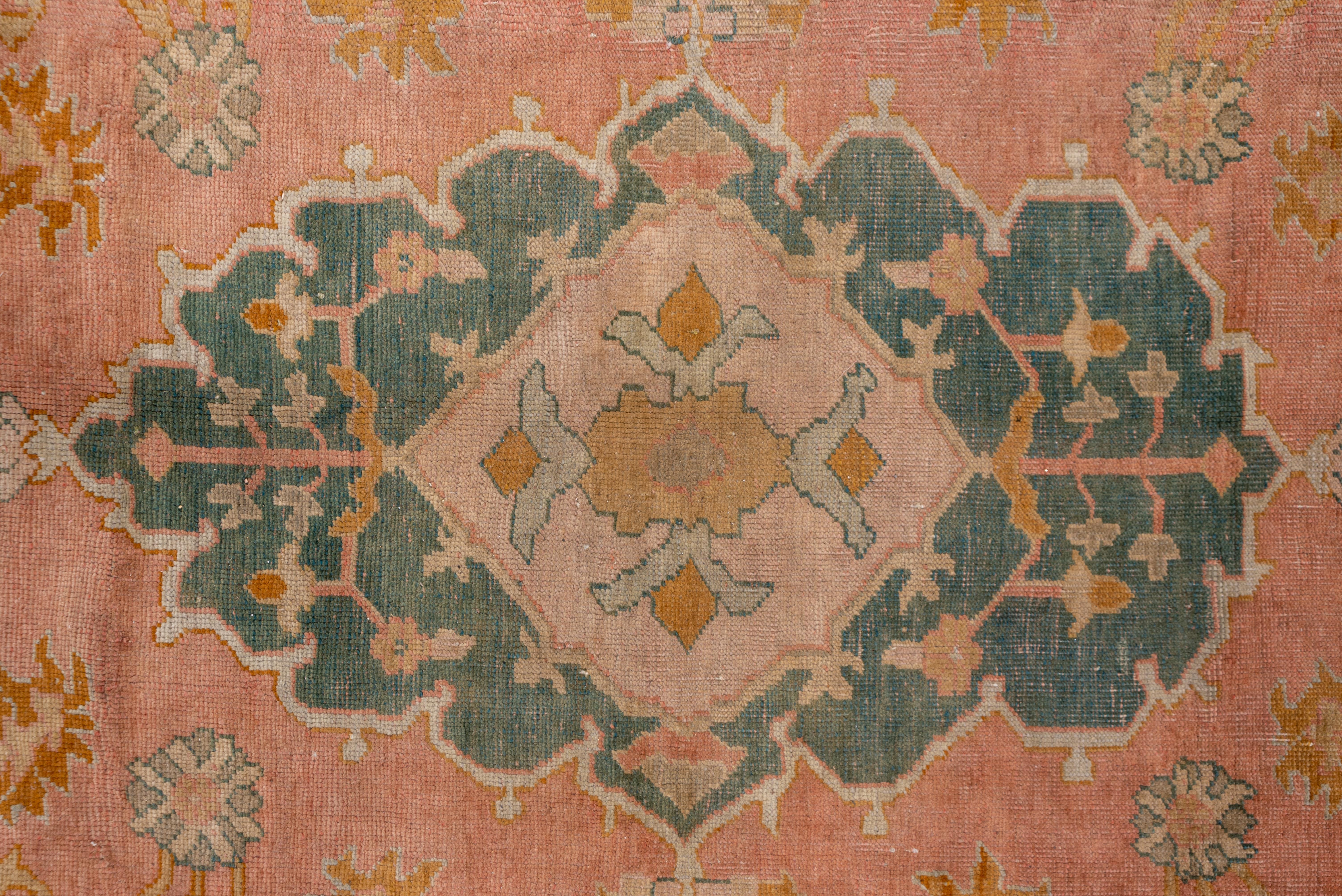 Early 20th Century 1910s Antique Turkish Oushak Rug, Pink FIeld, Dark Green & Orange Borders For Sale