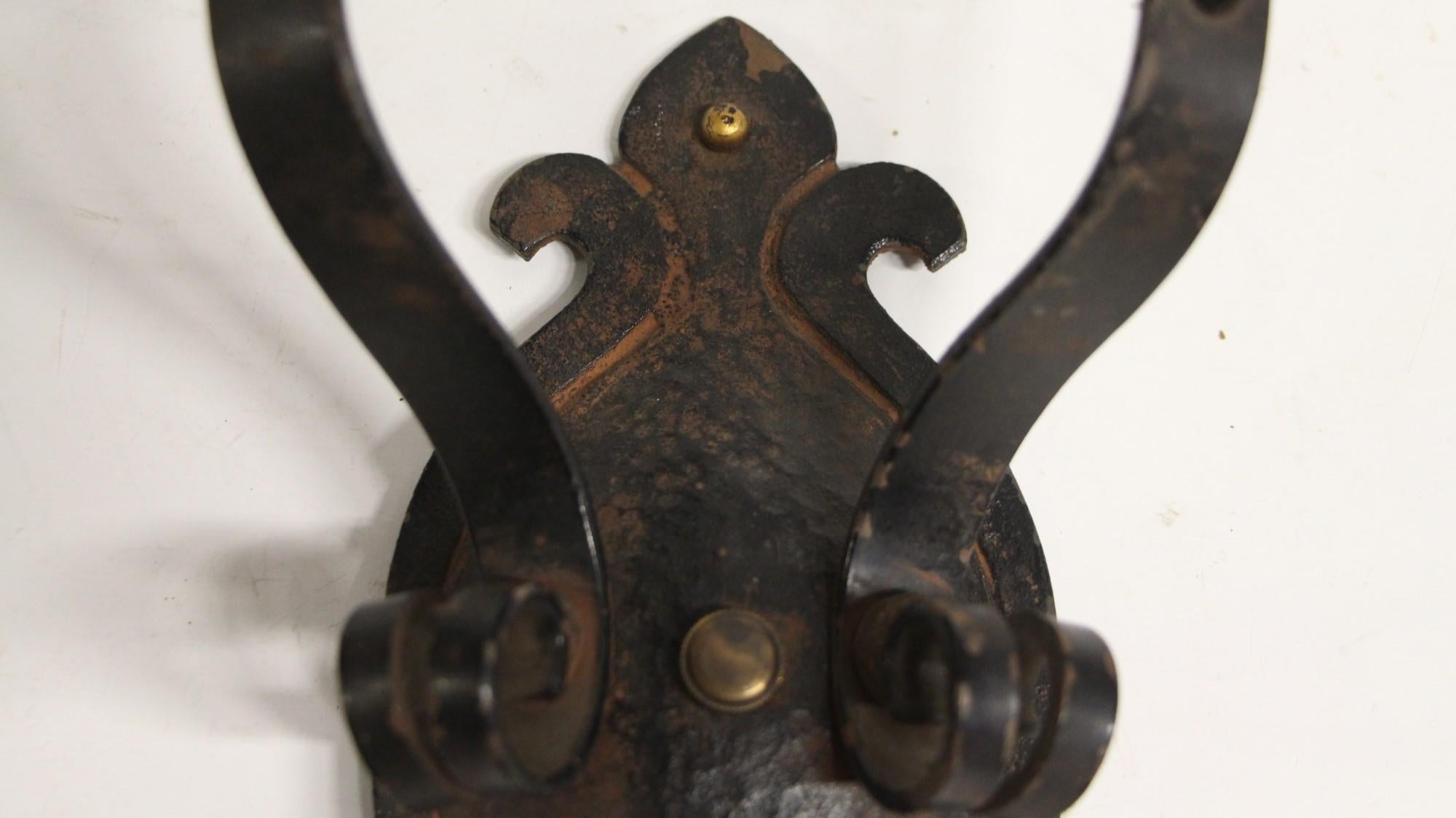 1910s wrought iron floral Arts & Crafts style hand hammered sconce. Newly cleaned and rewired. This can be seen at our 400 Gilligan St location in Scranton. PA.