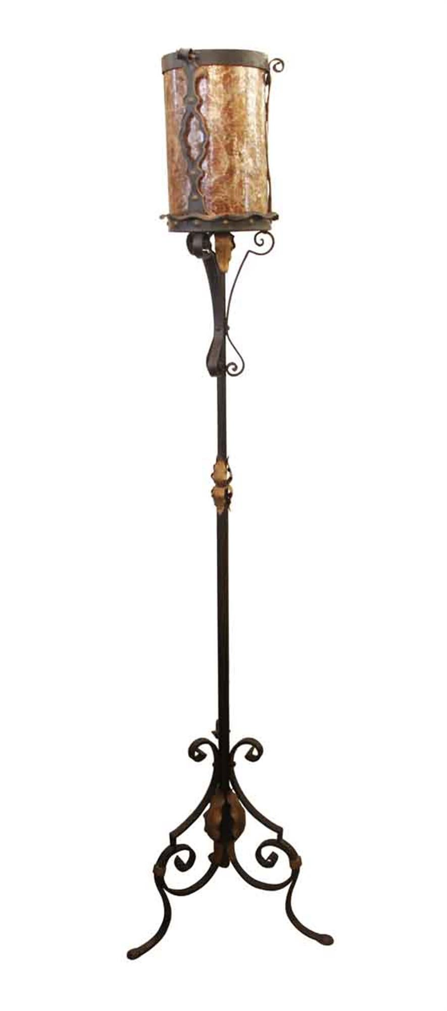 1910s Arts & Crafts style hammered and pinned wrought iron floor lamp with a reddish brown mica shade. The shade is removable. This can be seen at our 2420 Broadway location on the upper west side in Manhattan.