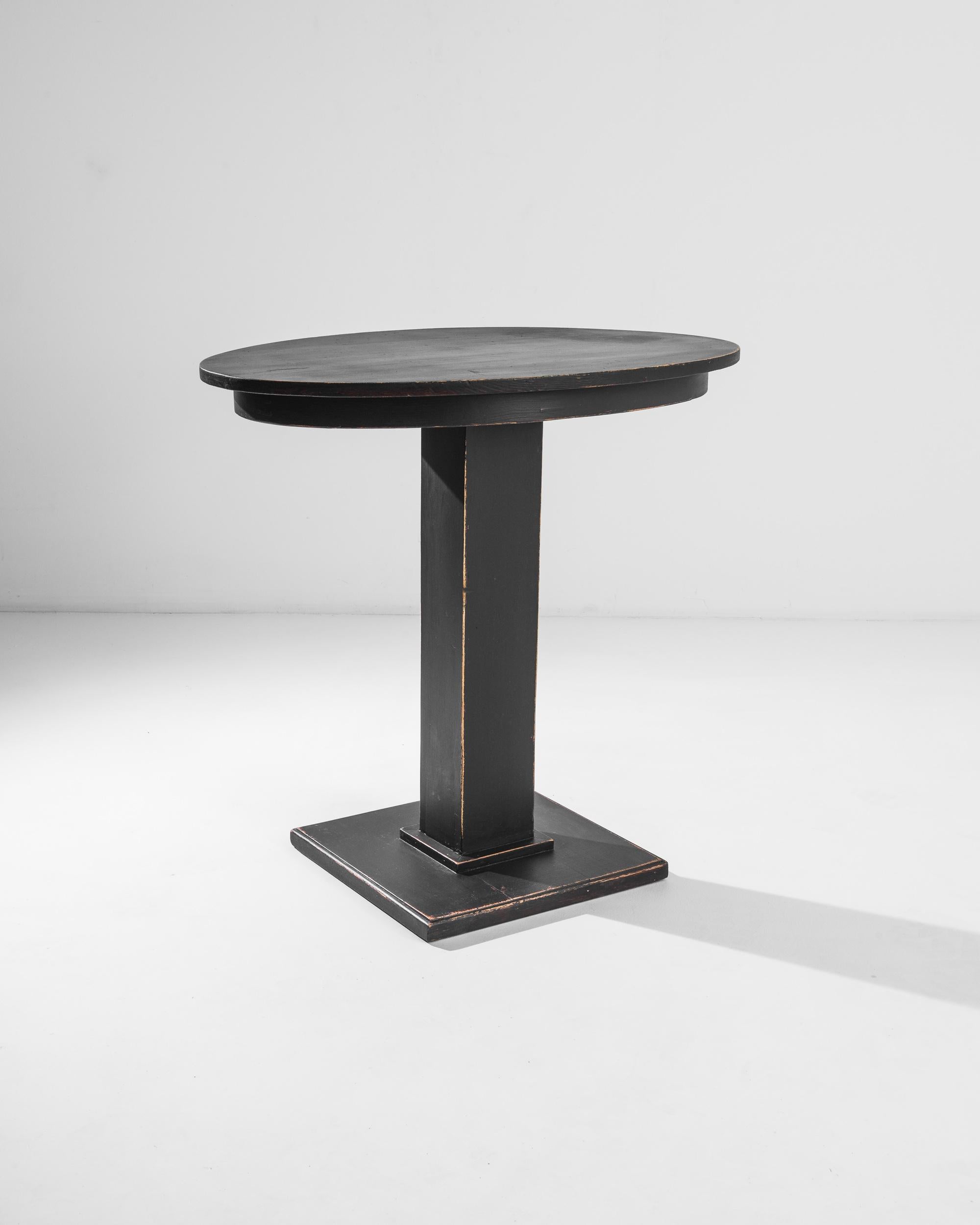 A black patinated wood side table from Central Europe, produced circa 1910. A chic side table from Central Europe, pulling styles from the past and presaging the era to come. This monochromatic stripping down to bare essentials, a table is a