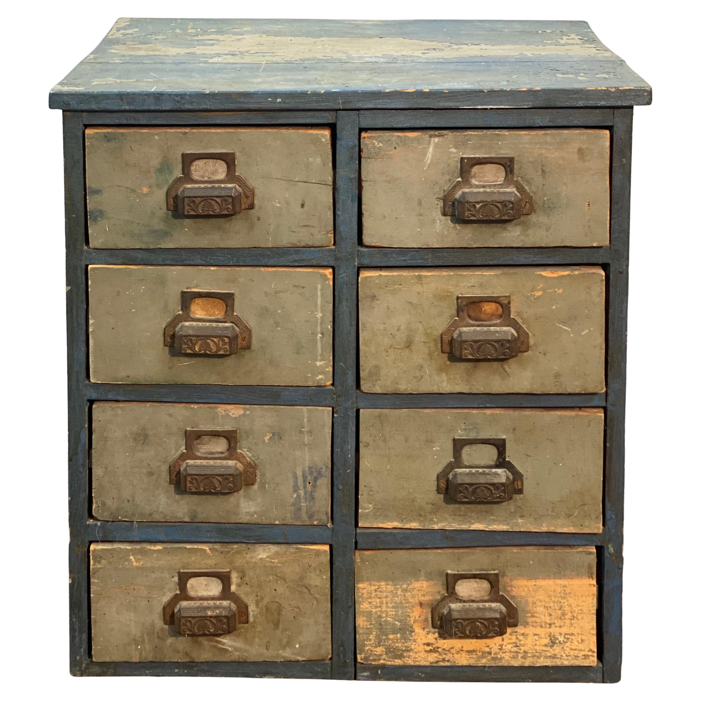 1910s Distressed Eight Drawer Apothecary Workshop Cabinet