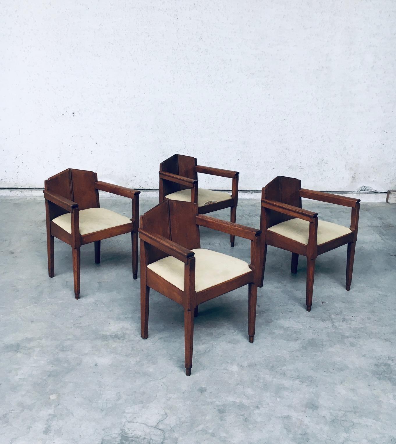 Vintage very Rare early Dutch Modernism Design Amsterdam School Dining Chair set of 4. Made in the Netherlands, Amsterdam, 1910 / 1920's period. Solid oak constrcuted chairs with fabric covered seats. Hand made oak wood arm chairs with wel thought