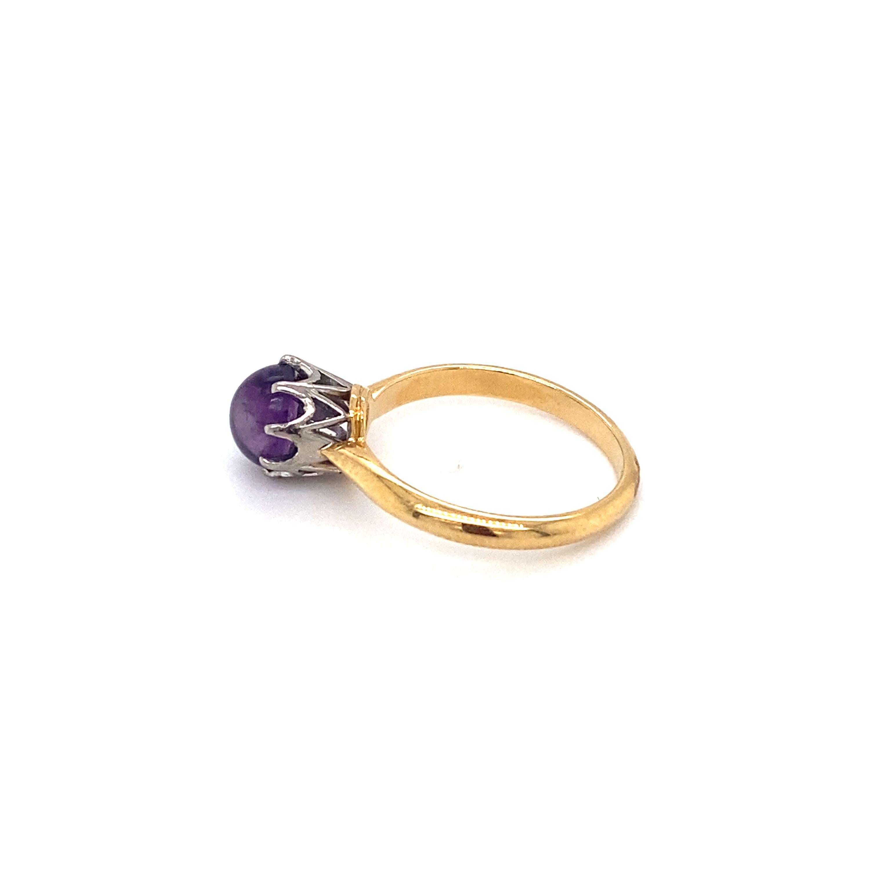 Item Details: 
Ring Size: 5.5
Metal Type: 18k yellow and white gold
Weight: 3.0 grams

Center Stone Details:
Stone Type: Cabachon Amethyst
Size: .75ct

Side Stone Details:
Stone Type: Diamonds
Weight: .25cttw
Color/ Clarity: G, VS1 (High Quality,