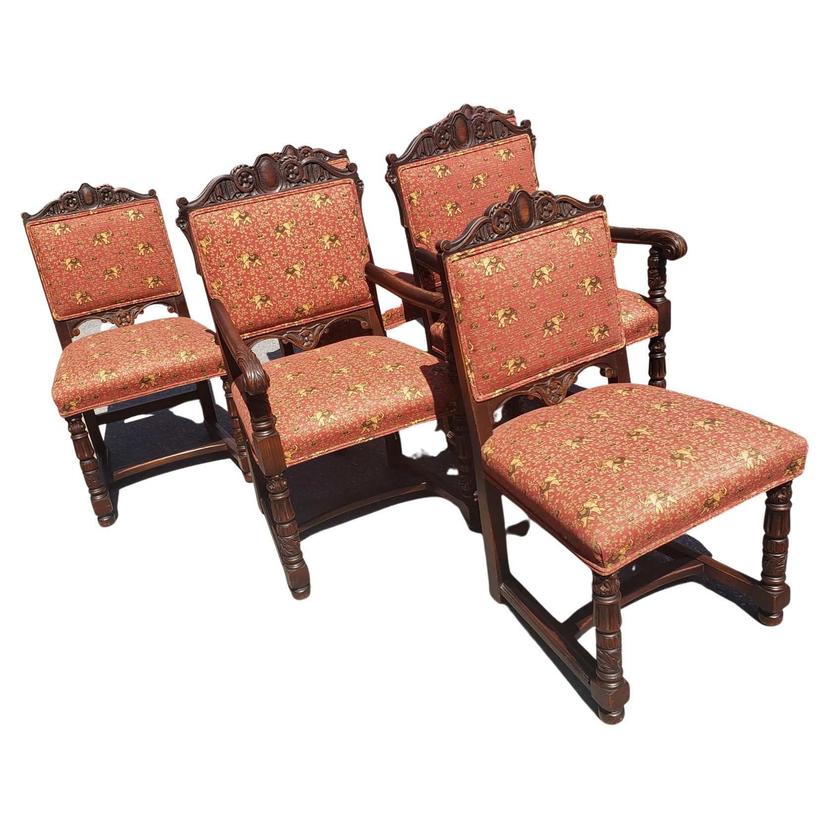 Set of six 1910s Edwardian hand carved Oak with 4 side chairs and 2 captain chairs. Intricately hand carved on back top, bottom and legs. Recently and professionally re-upholstered with custom fabric with elephant theme. Measurements are:
21.5