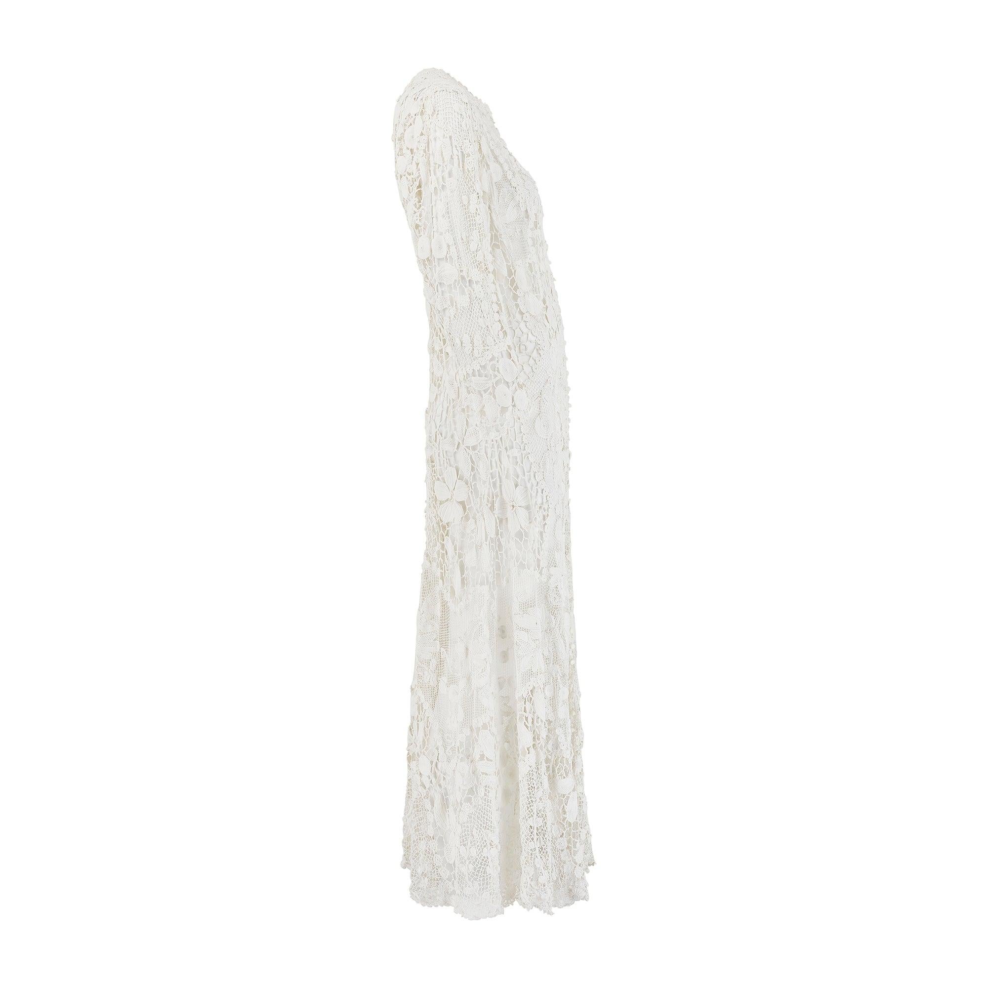 This intricately hand crafted full-length jacket dates back to the late Edwardian era of the 1910s. This piece is a wonderful example of crochet and one of the best Circa has ever had in the collection. Derived from the French word for hook, crochet