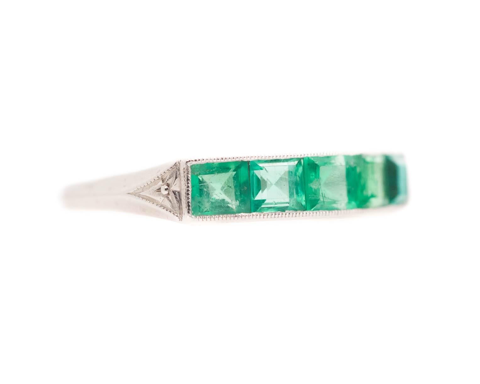 1915 Edwardian Era Antique Platinum & Colombian Emerald Ring

Features 1.0 cttw Square Emerald cut Colombian Emeralds. The 5 square emerald cut stones are set horizontally in shining Platinum. The Platinum accentuates the beauty of the gorgeous