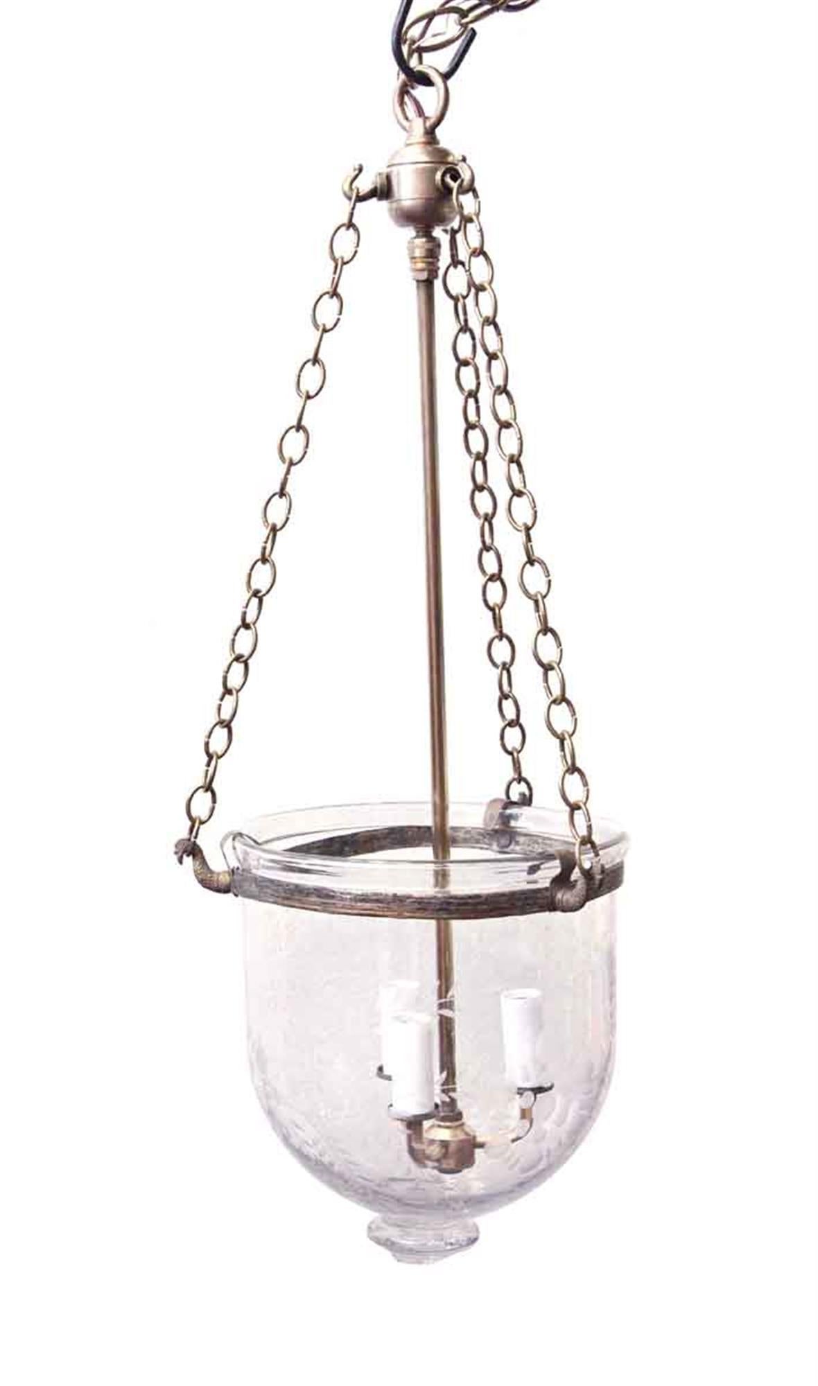 1910s hand blown crystal bell jar light with decorative etched detail and three candlestick lights. This light has been completely restored with new wiring and brass hardware. The globe, trim and finial are all original. This can be seen at our 2420