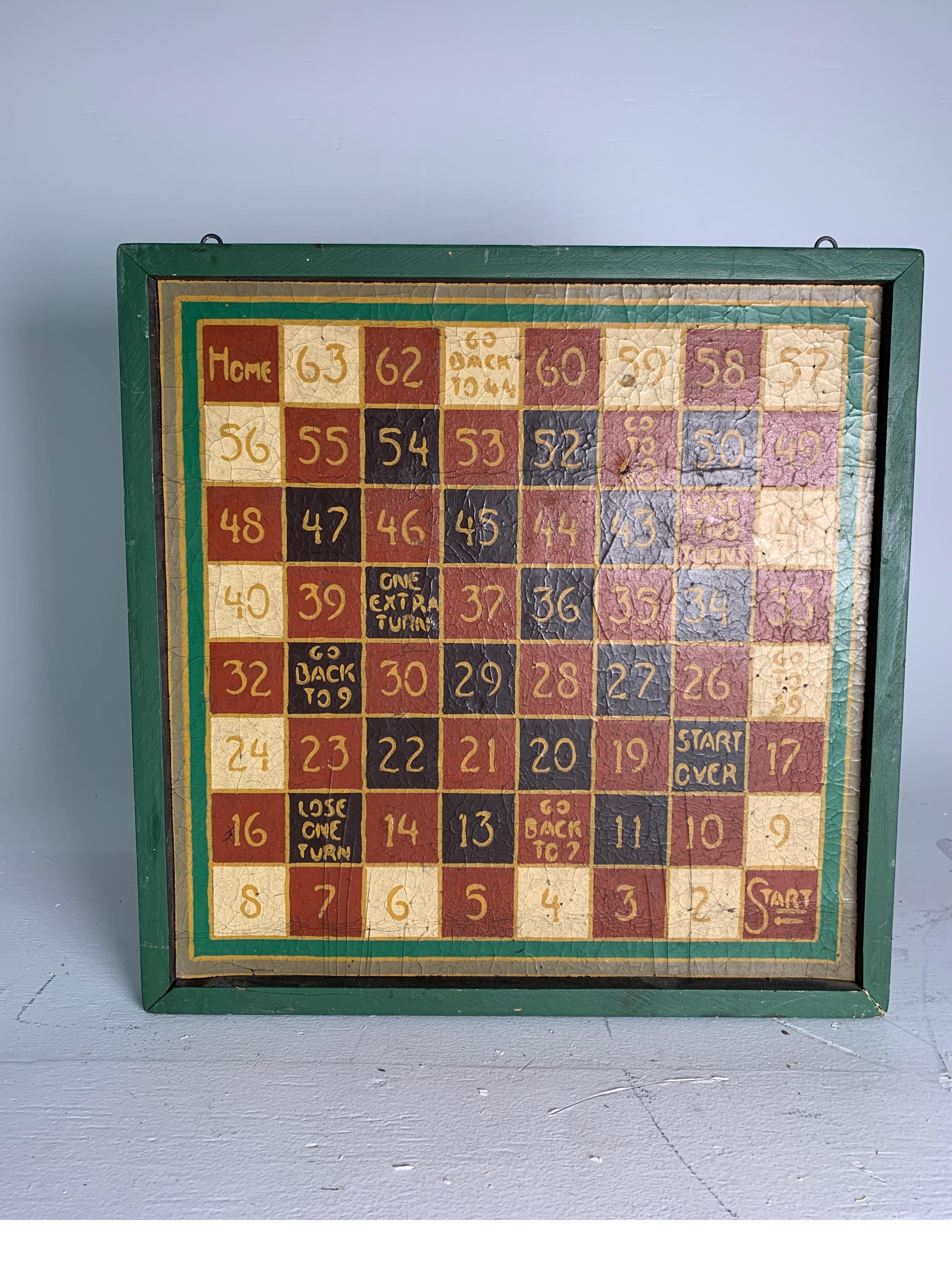 An early 20th century Folk Art painting on canvas of a game board in custom frame. The canvas painting mounted on board with original vibrant colors. Measures: 20 inches square.