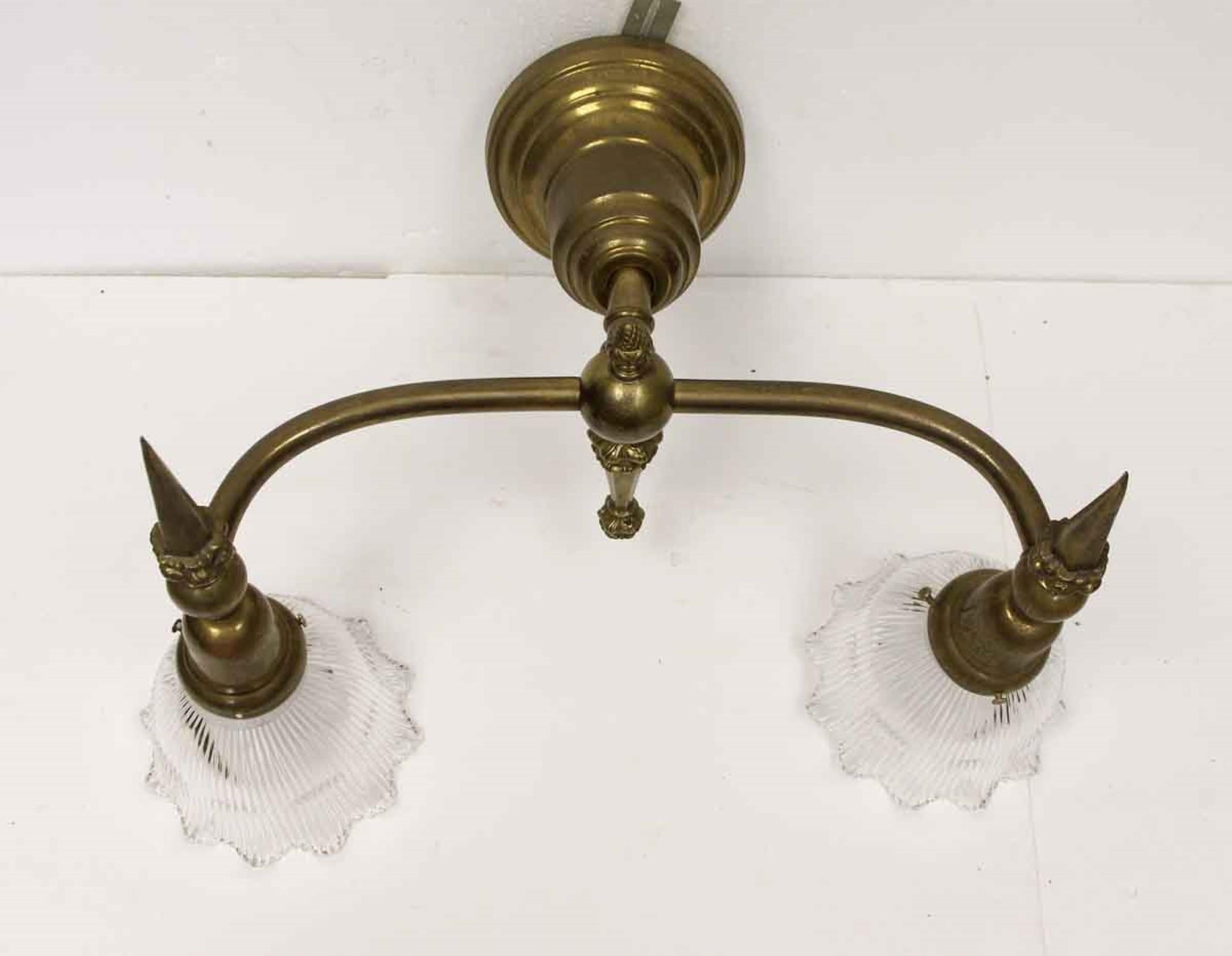 1910s large cast brass two-arm sconce with original ruffled prism glass shades. Cleaned and rewired. Small quantity available at time of posting. Priced each. Please inquire. Please note, this item is located in our Scranton, PA location.