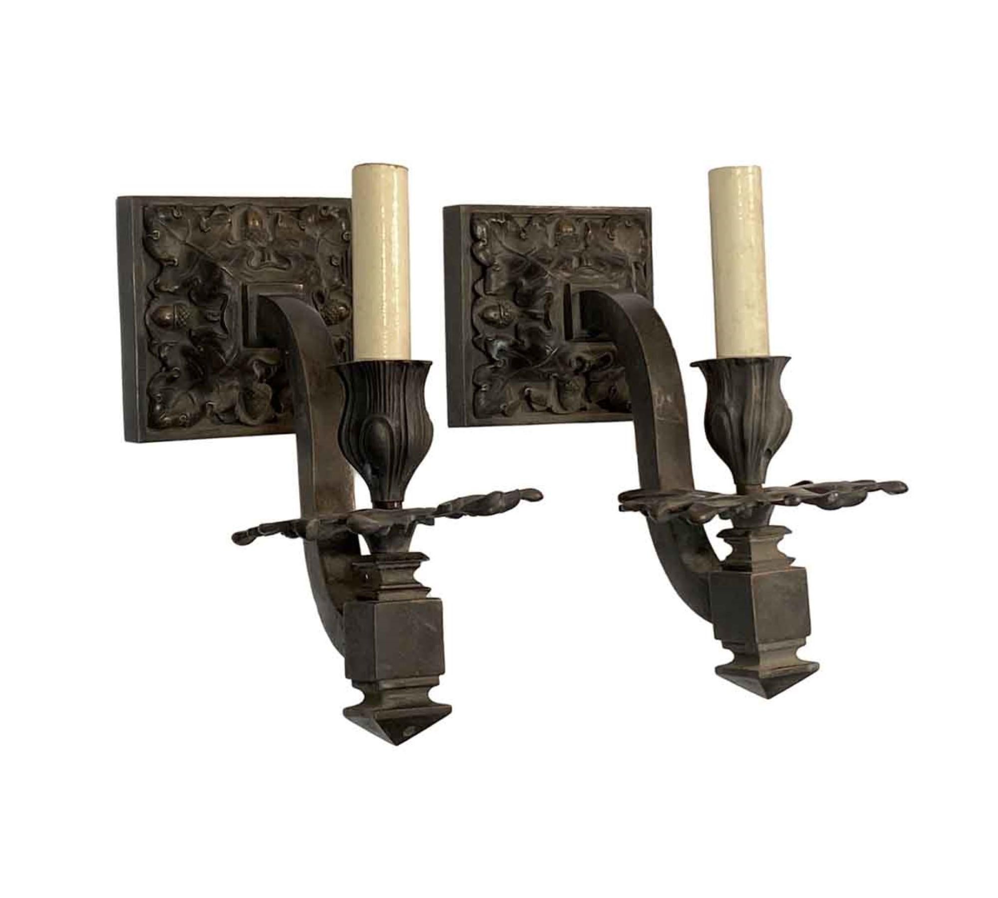 1910s pair of cast bronze one arm acorn and oak leaf detail wall sconces from France. Price includes restoration.