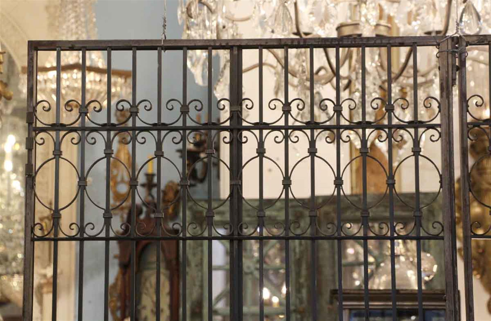 1910s wrought iron elevator doors with a black finish. Priced as a pair. From a Manhattan building. This can be seen at our 333 W 52nd St location, located in the Theater District West of Manhattan.