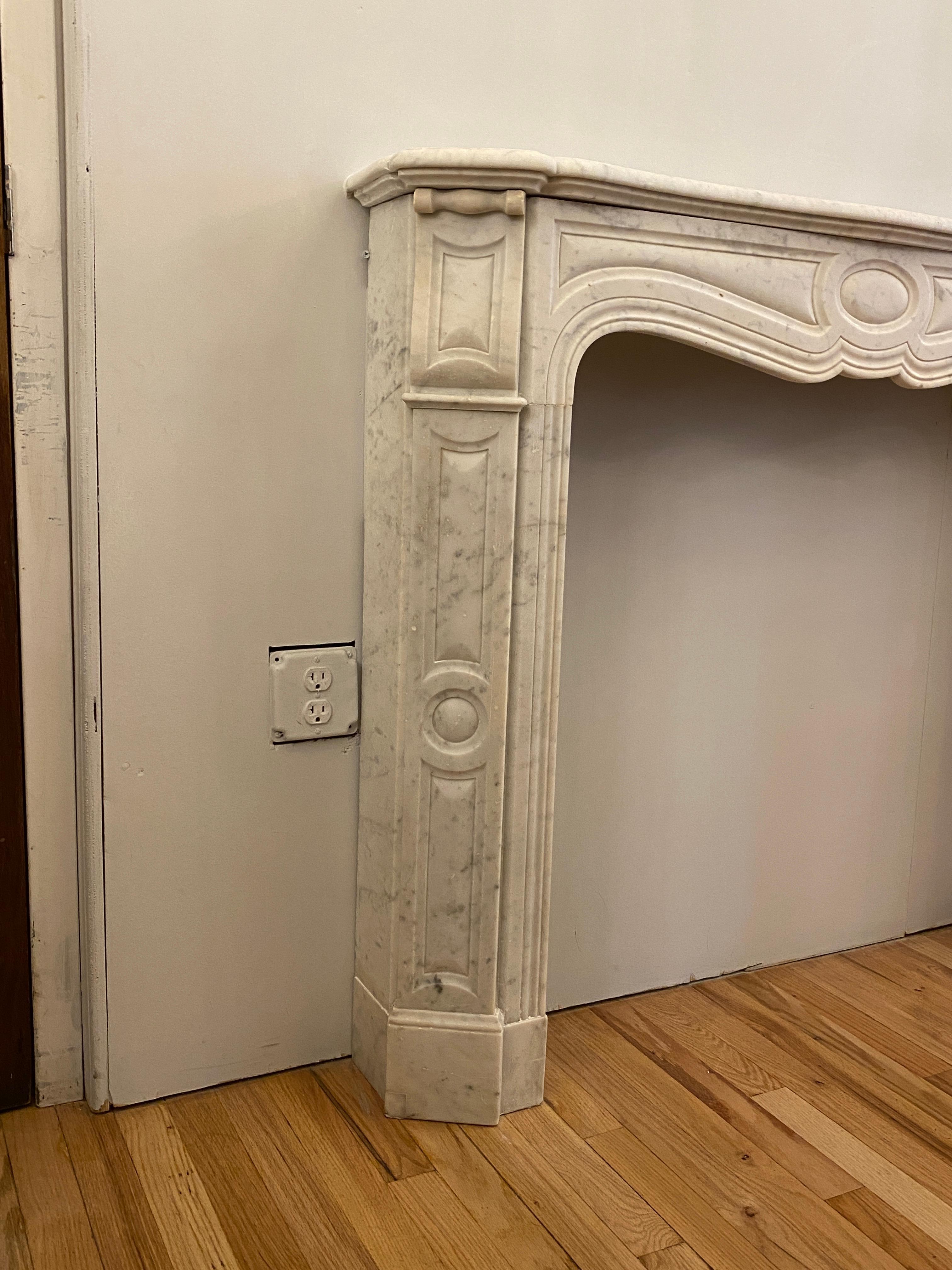 Early 20th Century 1910s Petite French White Carrara Marble Mantel from West 9th St in Manhattan