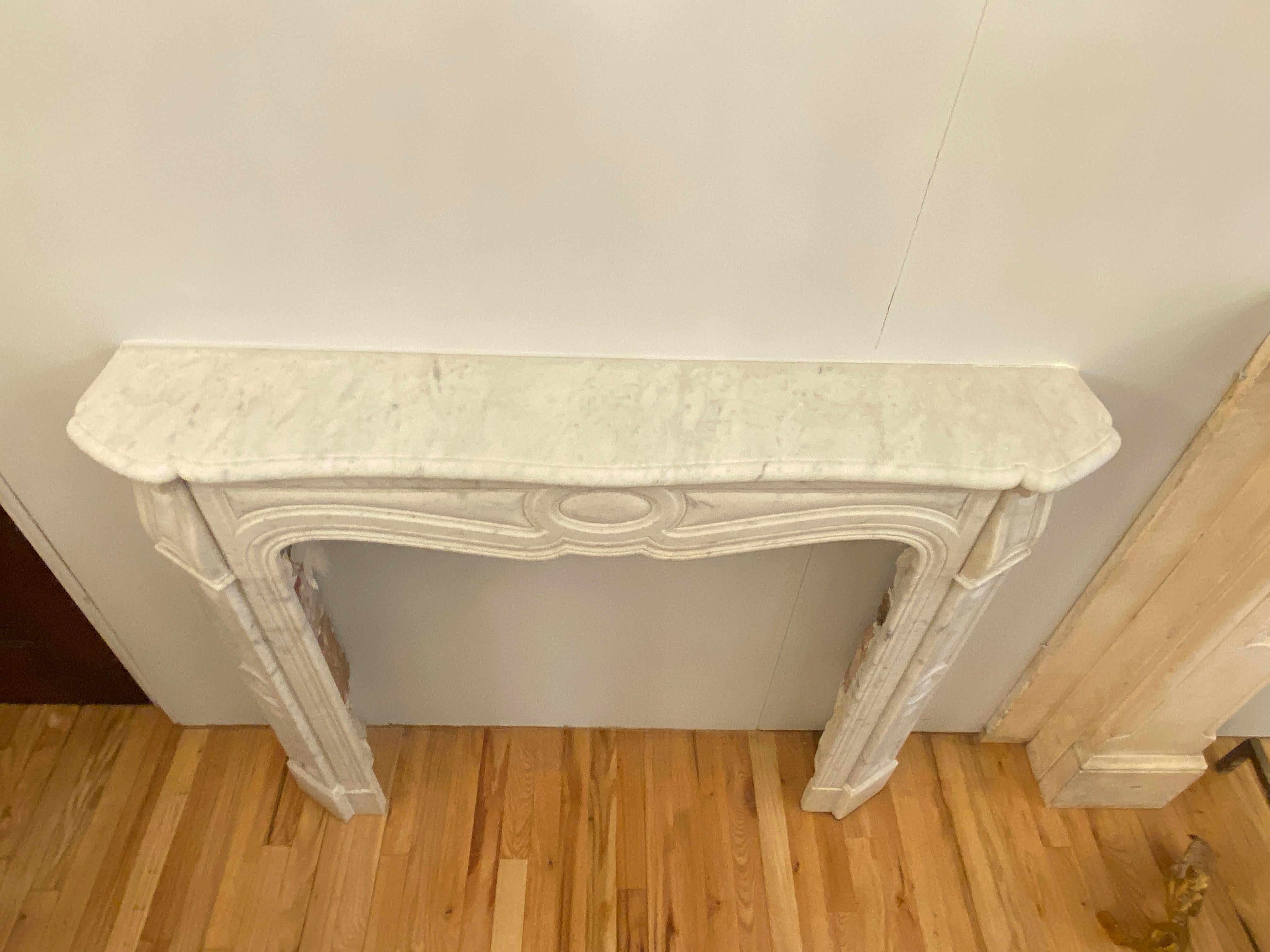 1910s Petite French White Carrara Marble Mantel from West 9th St in Manhattan 1