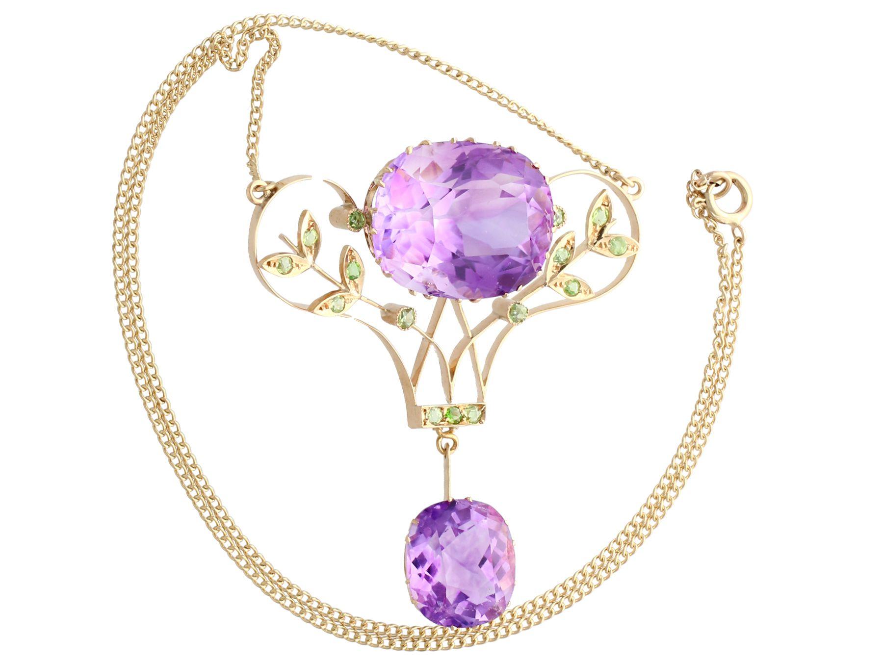 A stunning, fine and impressive antique 40.68 Ct amethyst and 1.26 Ct demantoid garnet, 14k yellow gold pendant; part of our diverse gemstone jewelry collections.

This stunning Russian antique pendant has been crafted in 14k yellow gold.

The