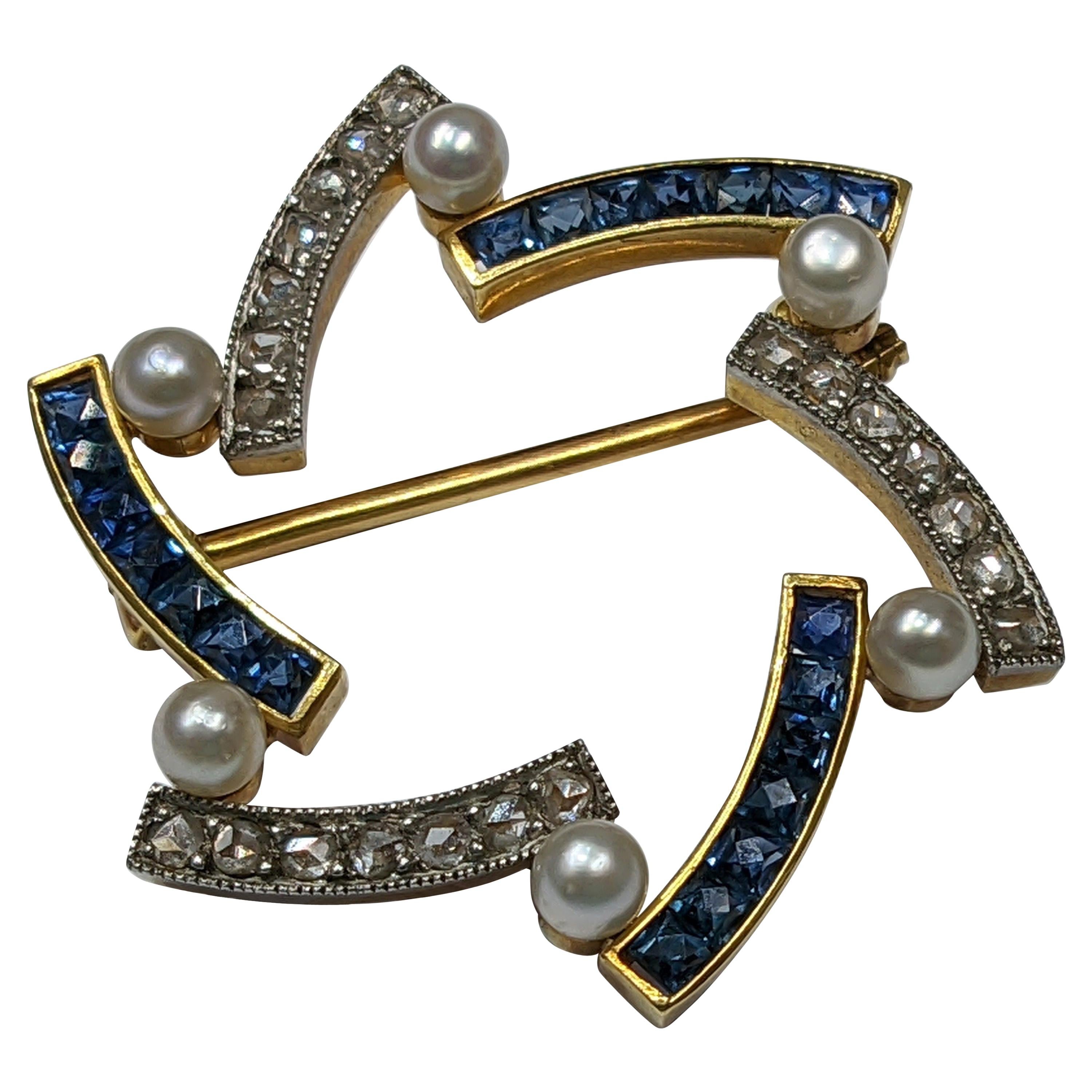 Épingle étoile des années 1910 avec saphirs, diamants et perles en vente
