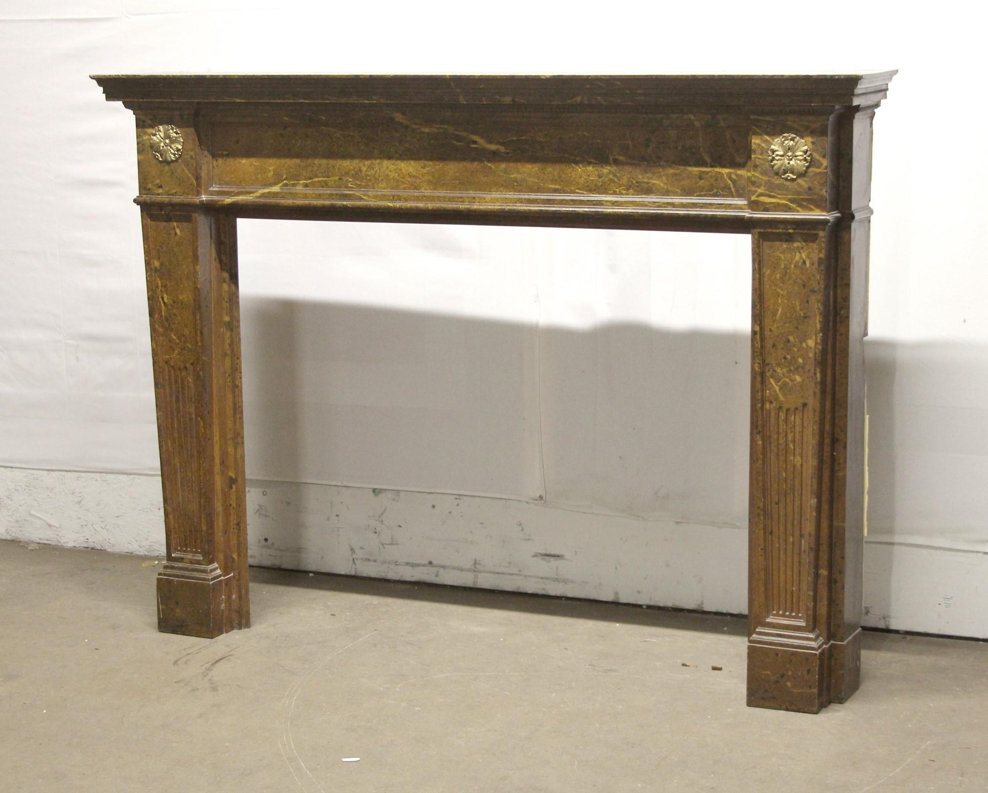 1910s Regency style wood mantel with two brass florets painted in a faux marble manner. Please note, this item is located in our Scranton, PA location.