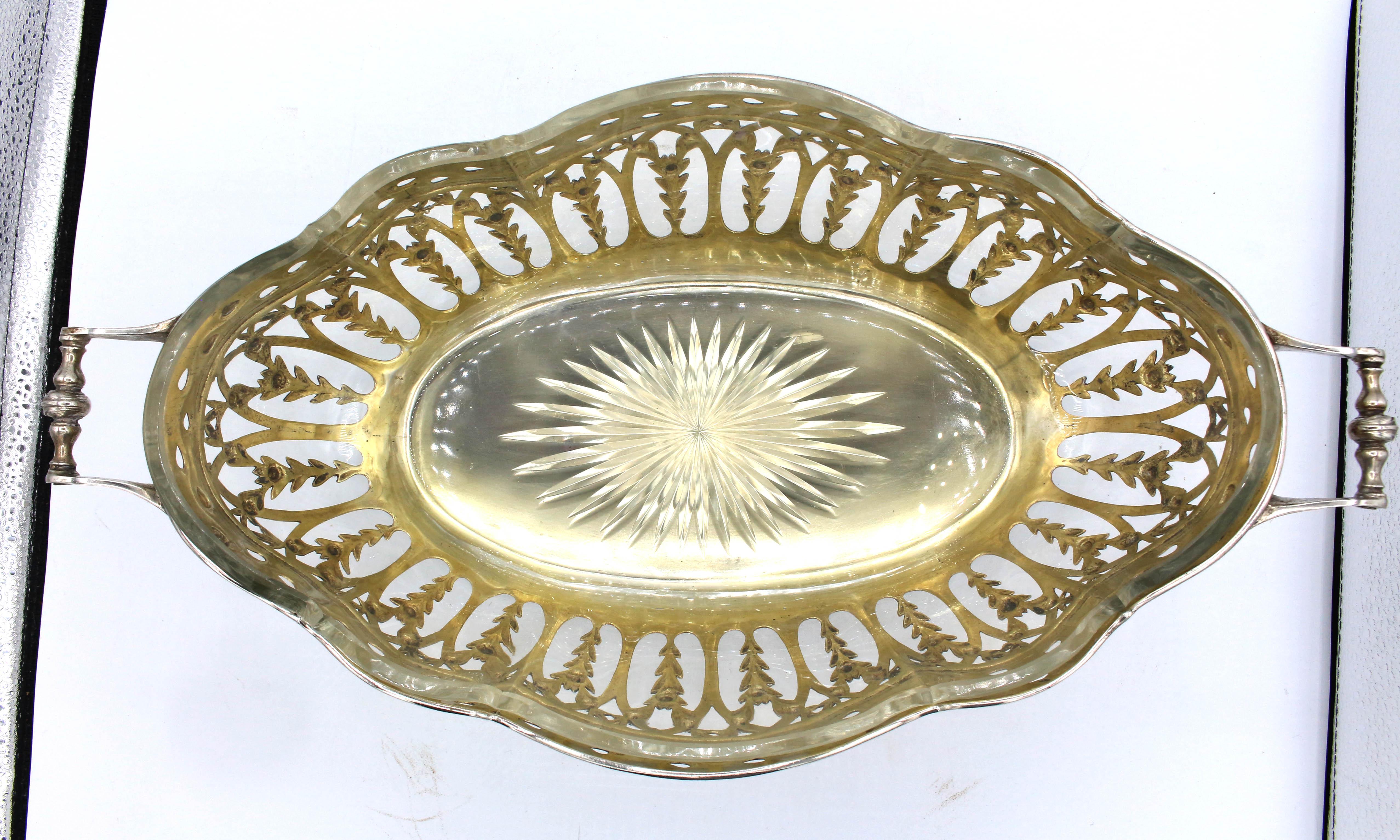 Continental 800 silver standard centerpiece bowl with liner, 1911. Original glass liner & gilded interior. The exterior is festooned with flowers. Running leaves border reticulation. Acanthus leaf scrolled feet. Marked 800 & SSH with a star. 33.70