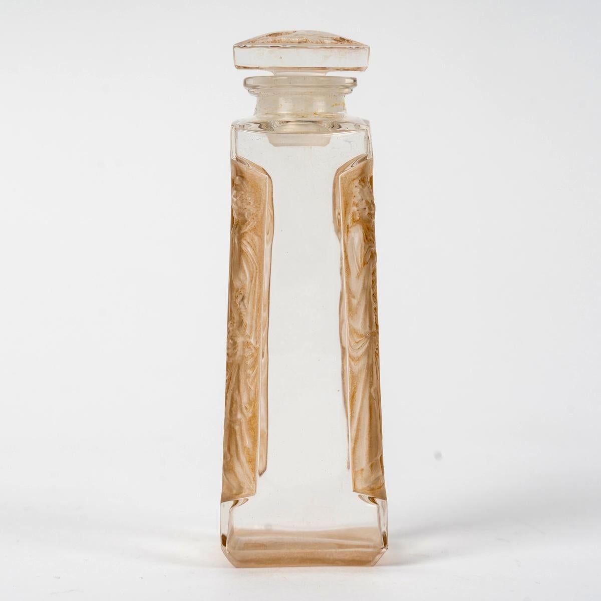 Art déco 1911 Rene Hisique Bouteille de parfum Quatre Aigles Four Eagles Verre patine sépia en vente