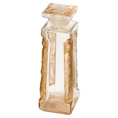 1911 René Lalique Frasco de perfume Quatre Aigles Cuatro águilas Vidrio pátina sepia