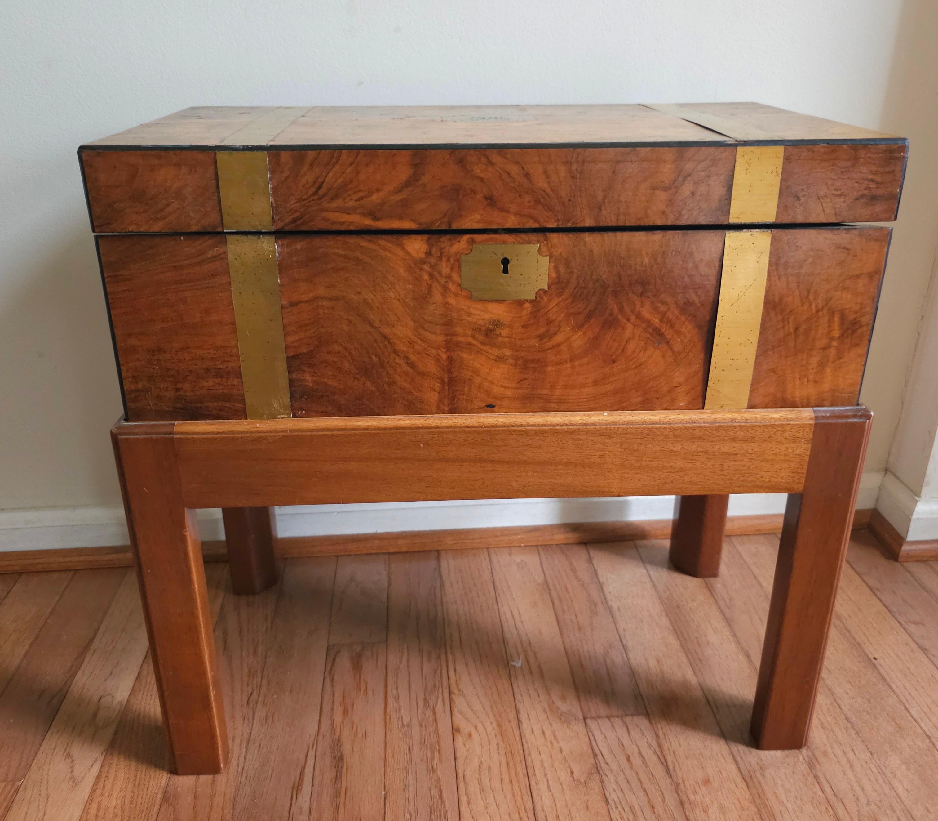 A 1911  Mahogany , brass inlays and leather inset traveling lap desk on stand. Measures 20.5