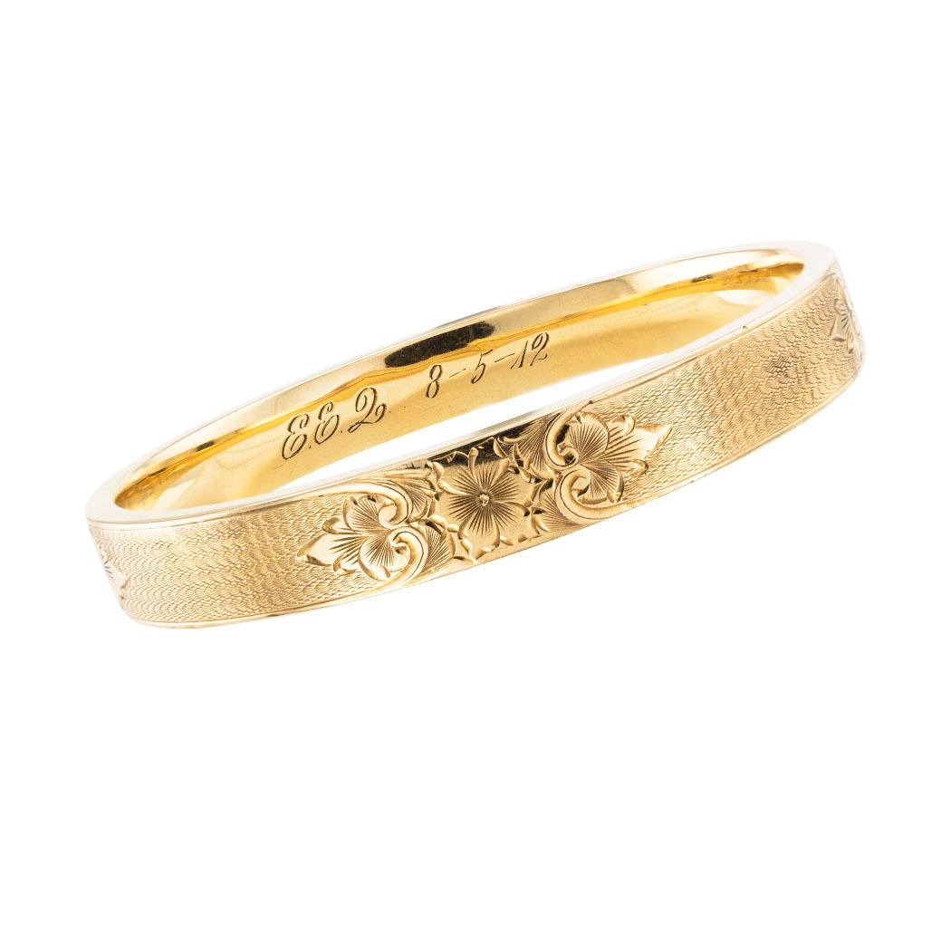 Antique yellow gold slip-on bangle bracelet dated 1912. *

SPECIFICATIONS:

DESIGN MOTIF: The engraved design motif repeats at each of the cardinal points. All sides of the bracelet are shown in the photographs. Dated 8-5-12.

METAL: 14-karat yellow