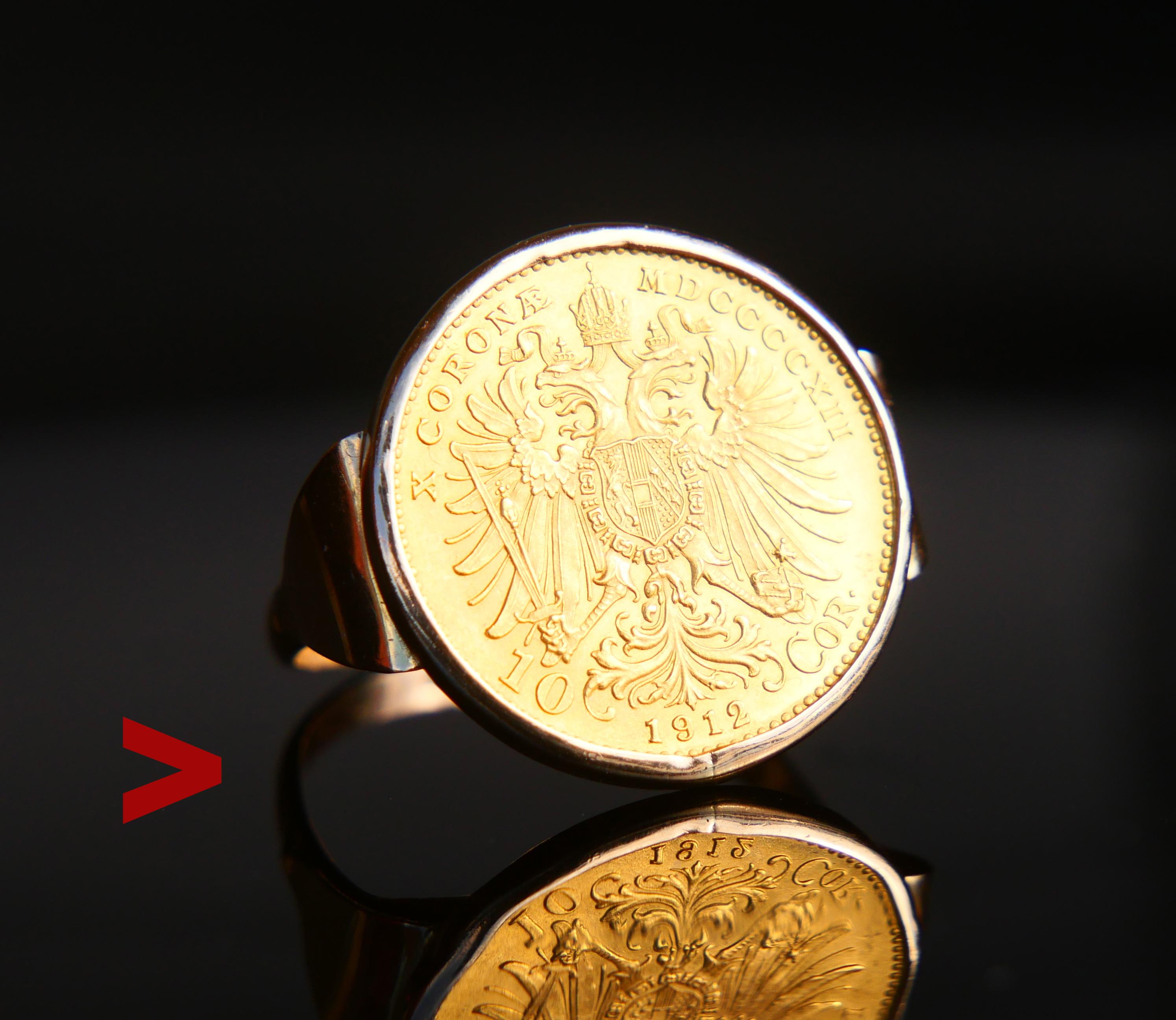 Bague de monnaie autrichienne ancienne pour homme ou femme, présentant une pièce autrichienne en or 10 Cronæ 23K encadrée d'une couronne et d'un anneau solides en rose Cold 14K.

La bande porte le poinçon standard impérial autrichien du début du XXe
