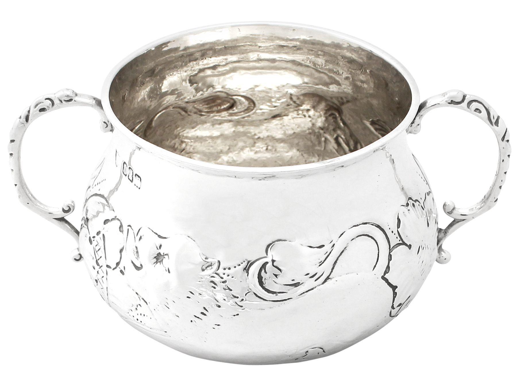 A very good antique George V English Britannia standard silver Charles II style porringer; an addition to our silverware collection.

This antique George V Britannia standard silver porringer has a circular shaped form in the Charles II