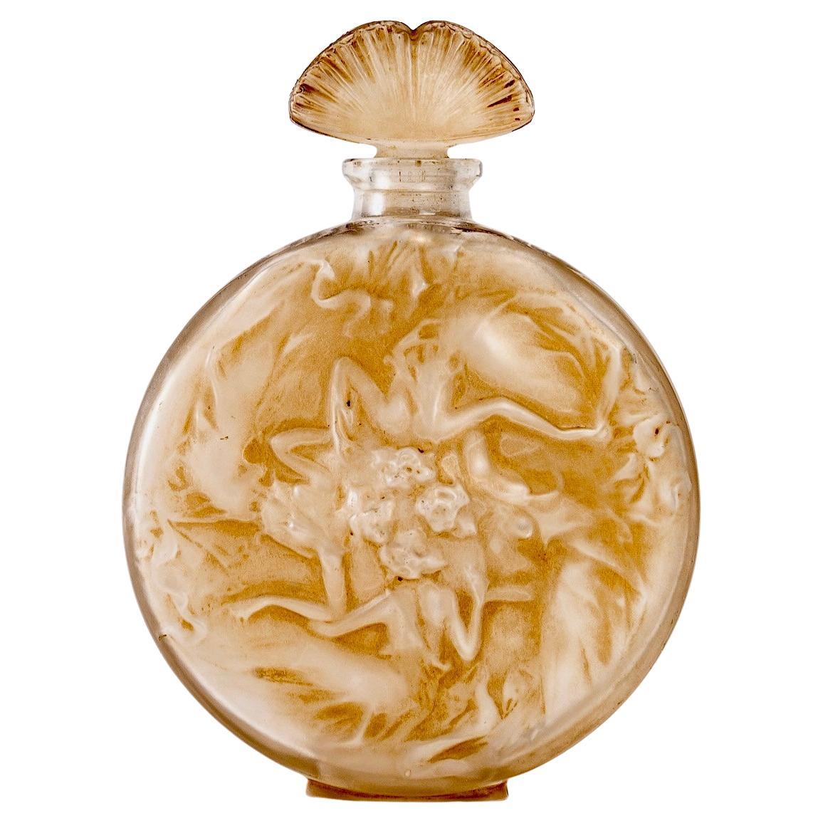 1912 René Lalique Bouteille de parfum Rosace Figurines Verre dépoli Patine sépia