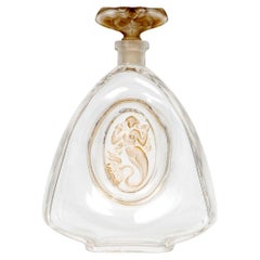 1912 Rene Lalique Bottiglia di profumo Sirenes in vetro con patina seppia per Burmann