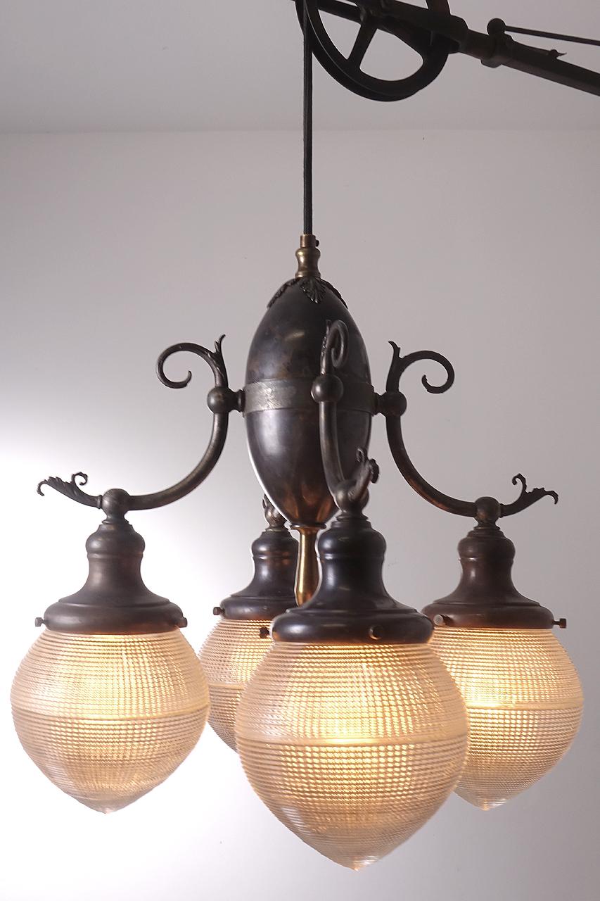 These lamps are impossible to come by and this example is a beautiful original. All we did was rewire it with the correct reproduction fabric covered pulley wire. It swings left to right and can extend from 4 to almost 5 foot from the wall. In