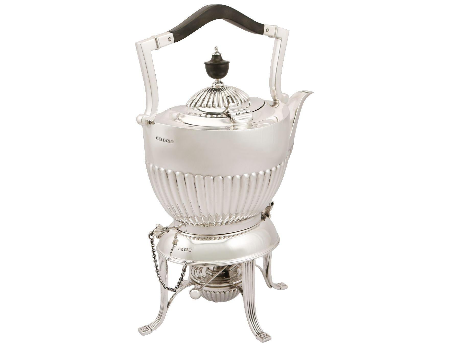 An exceptional, fine and impressive antique George V English sterling silver spirit tea kettle made in the Queen Anne style; an addition to our antique silver teaware collection.

This exceptional antique George V sterling silver spirit kettle on