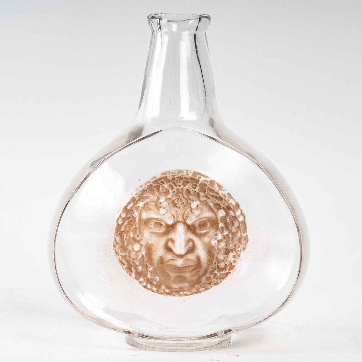 Molded 1913 René Lalique, Decanter Masques Clear Glass with Sepia Patina