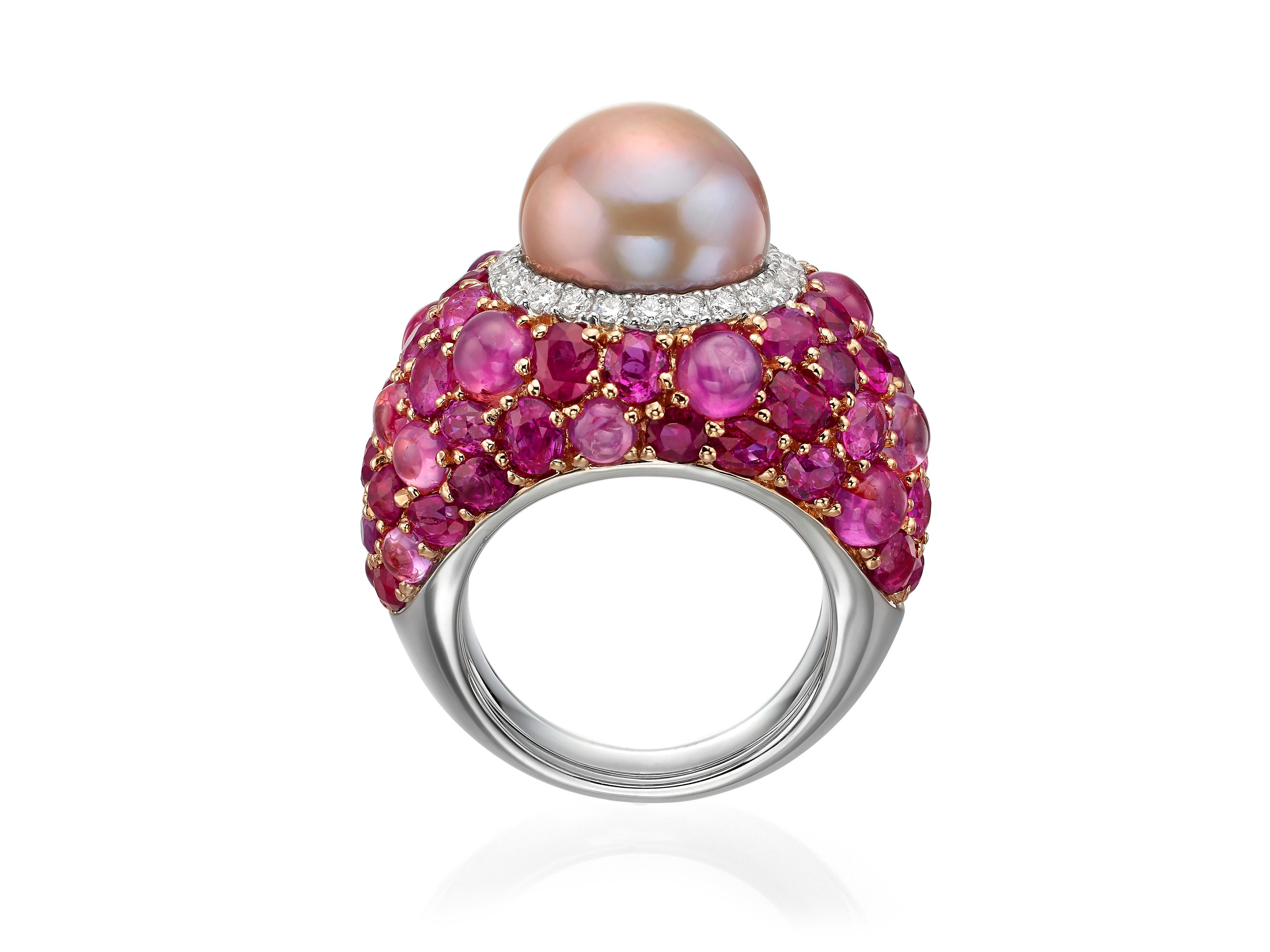 Crafted from 18K rose gold, this cocktail ring features a 13MM freshwater pink pearl at the center surrounded by a halo of white diamonds (totaling 0.51 carats) and a clusters of pink sapphires and rubies (totaling 17.80 carats).  Currently a ring