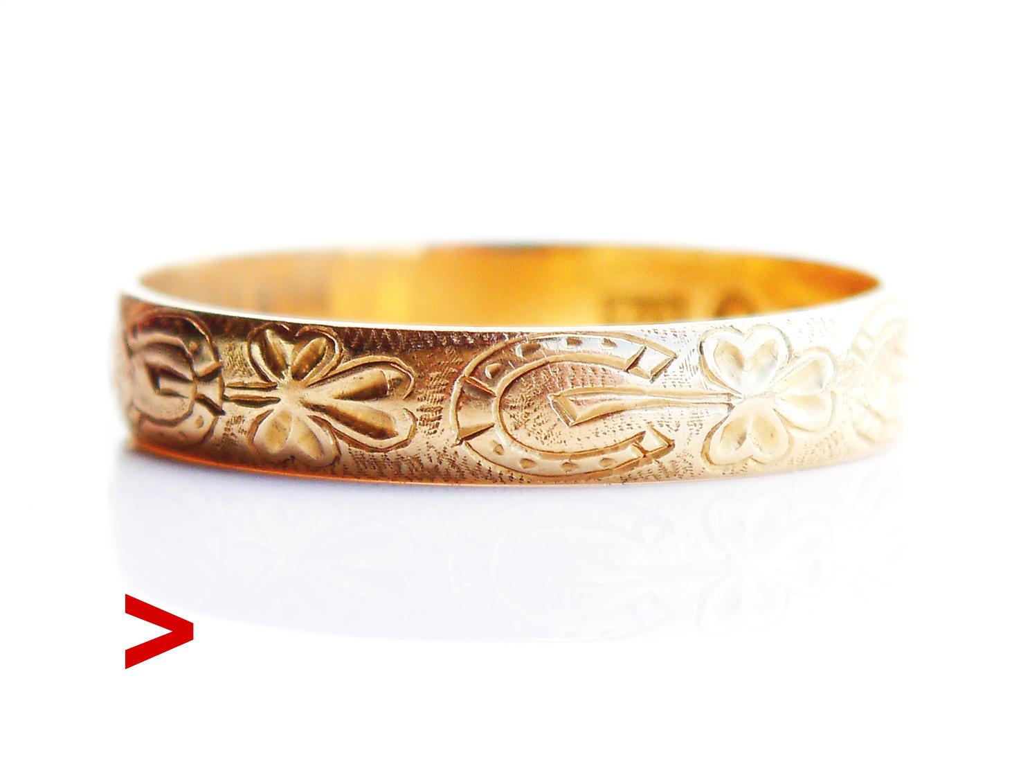 Old Wedding Ring with continuous hand-engraved floral ornament of Horse Shoes and Clover Leaves on the band, in solid 18 K Gold. Swedish hallmarks, 18K. Three Crowns. Made in 1914 (year marks M7) .

The band is 4 mm wide. Size: Ø US 10.75 / 20.44