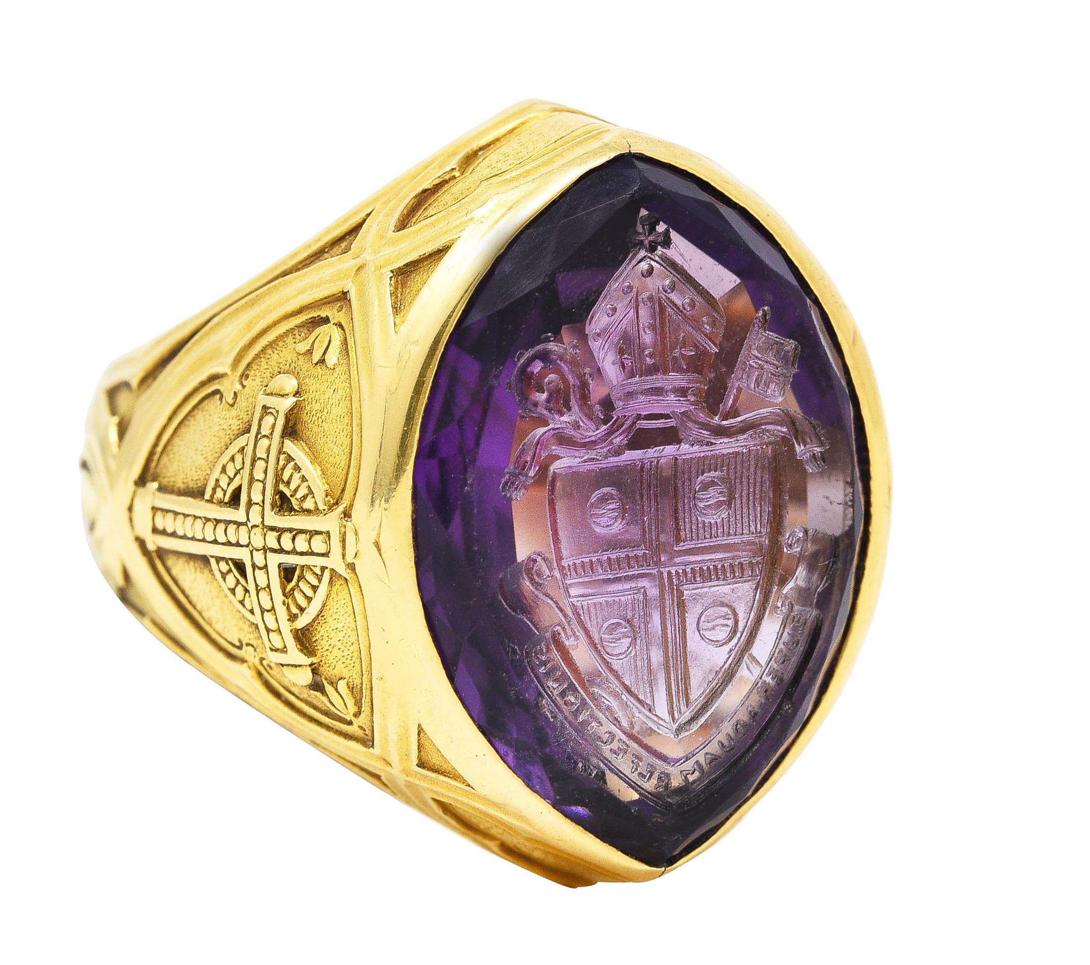 Centering a mixed cut navette shaped amethyst cabochon carved with an intaglio depicting a bishop's seal. With a bishop's headdress, shield, and banner with the Latin words 'Svper Aquam Refectionis'. Translating to 'By The Water of Refreshment' -