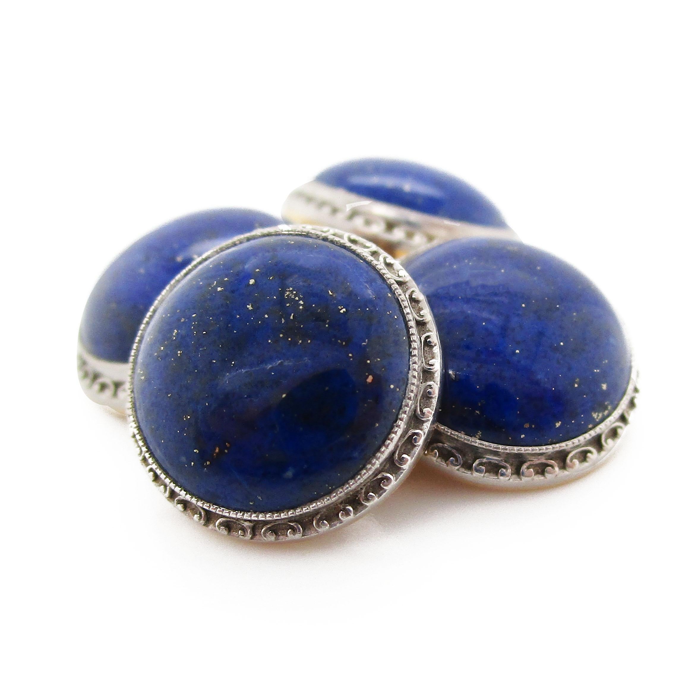 These incredible Art Deco cufflinks feature rich platinum over 14k yellow gold surrounding a stunning royal blue lapis cabochon center. The platinum over gold frame bears a fine detailing that adds a subtle touch to already magnificent cufflinks.