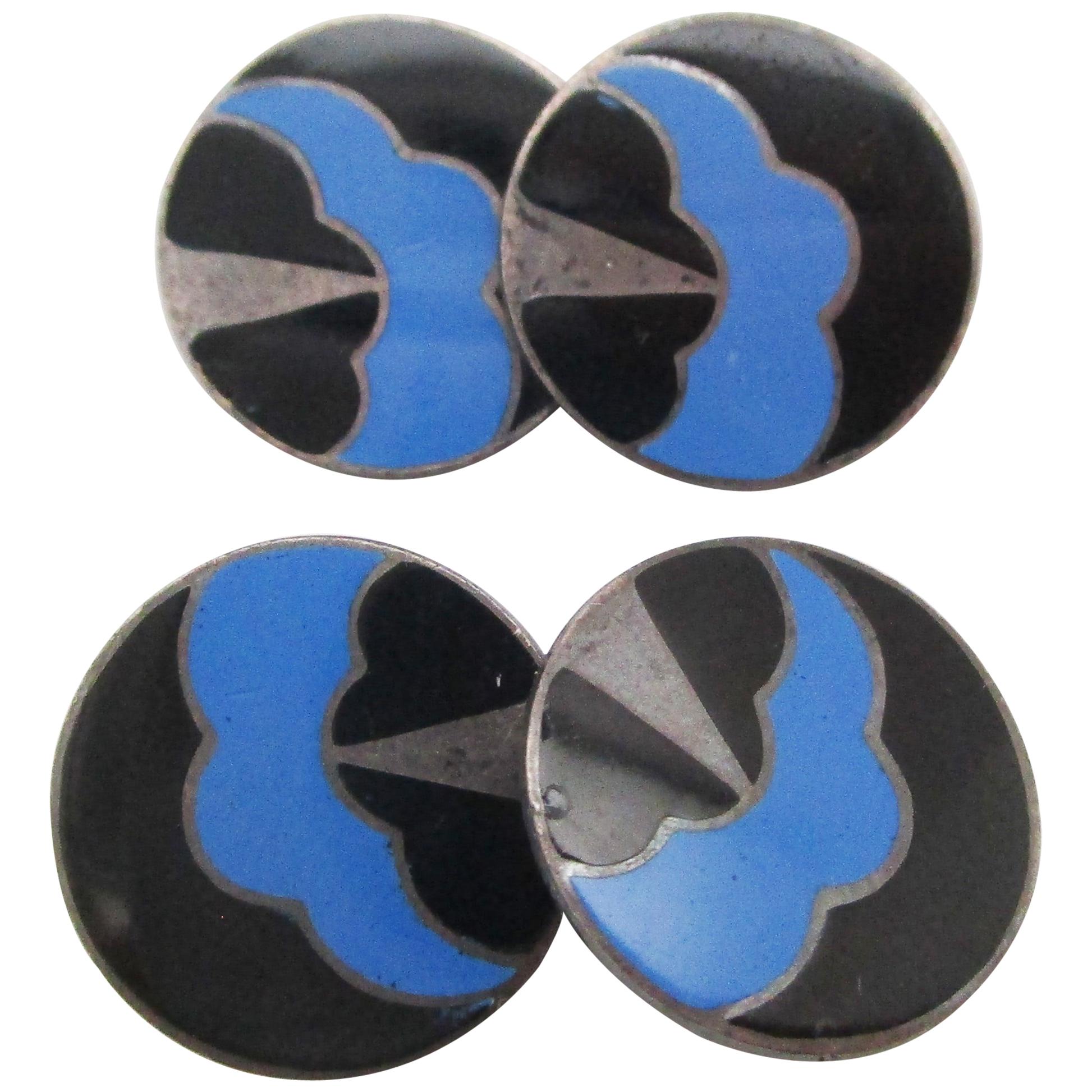 These classically elegant sterling silver cufflinks date back to 1915 and boast the bold, colorful design of the Art Deco era in the form of an abstract enamel thundercloud motif. The round panels allow a degree of versatility that can transform the