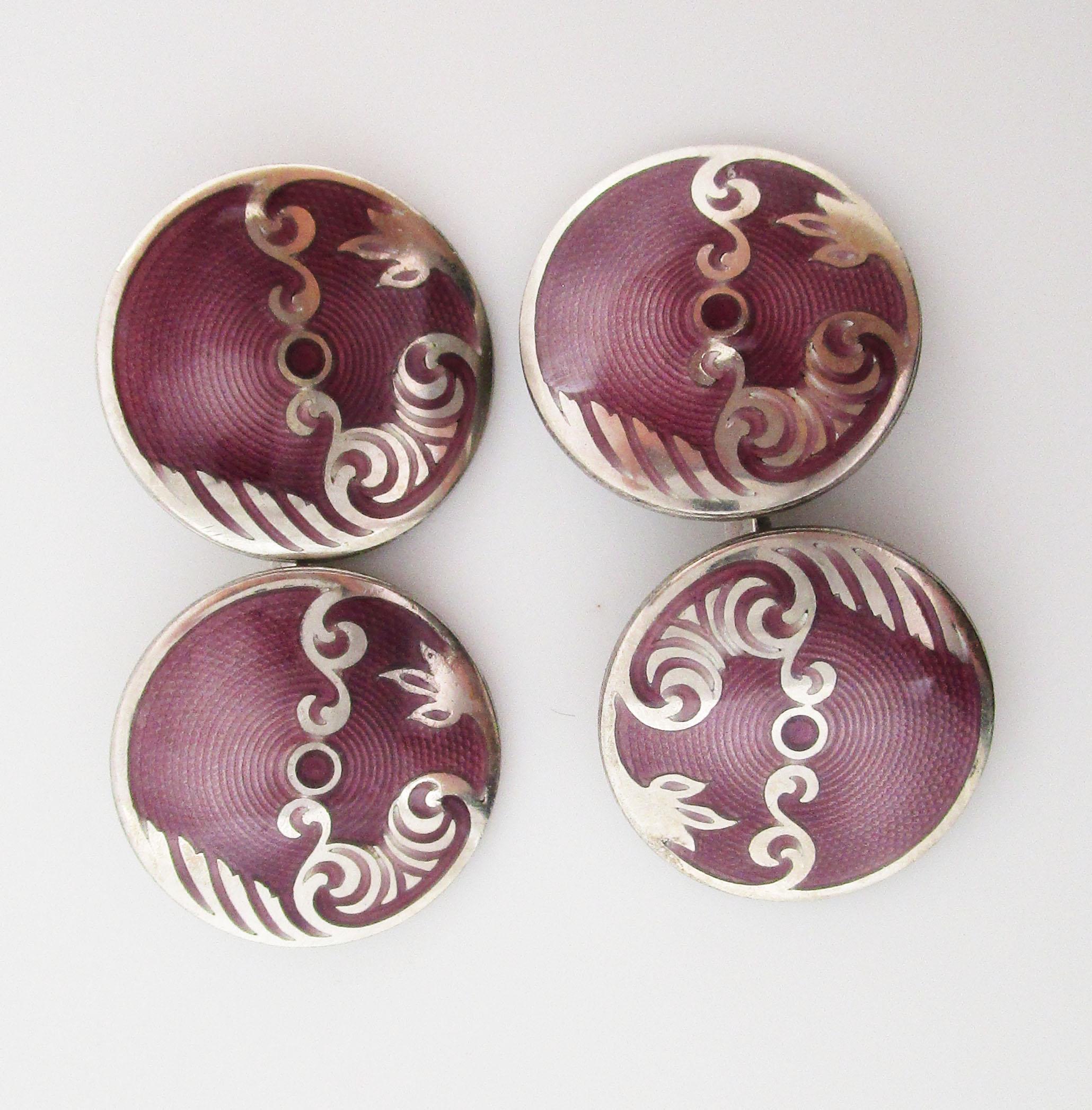 These elegant cufflinks feature a purely Art Deco design of arching curves in sterling silver accented by a rich shade of warm lavender that is incredibly unique! The links have a classic round shape, but what makes this set special is the finely
