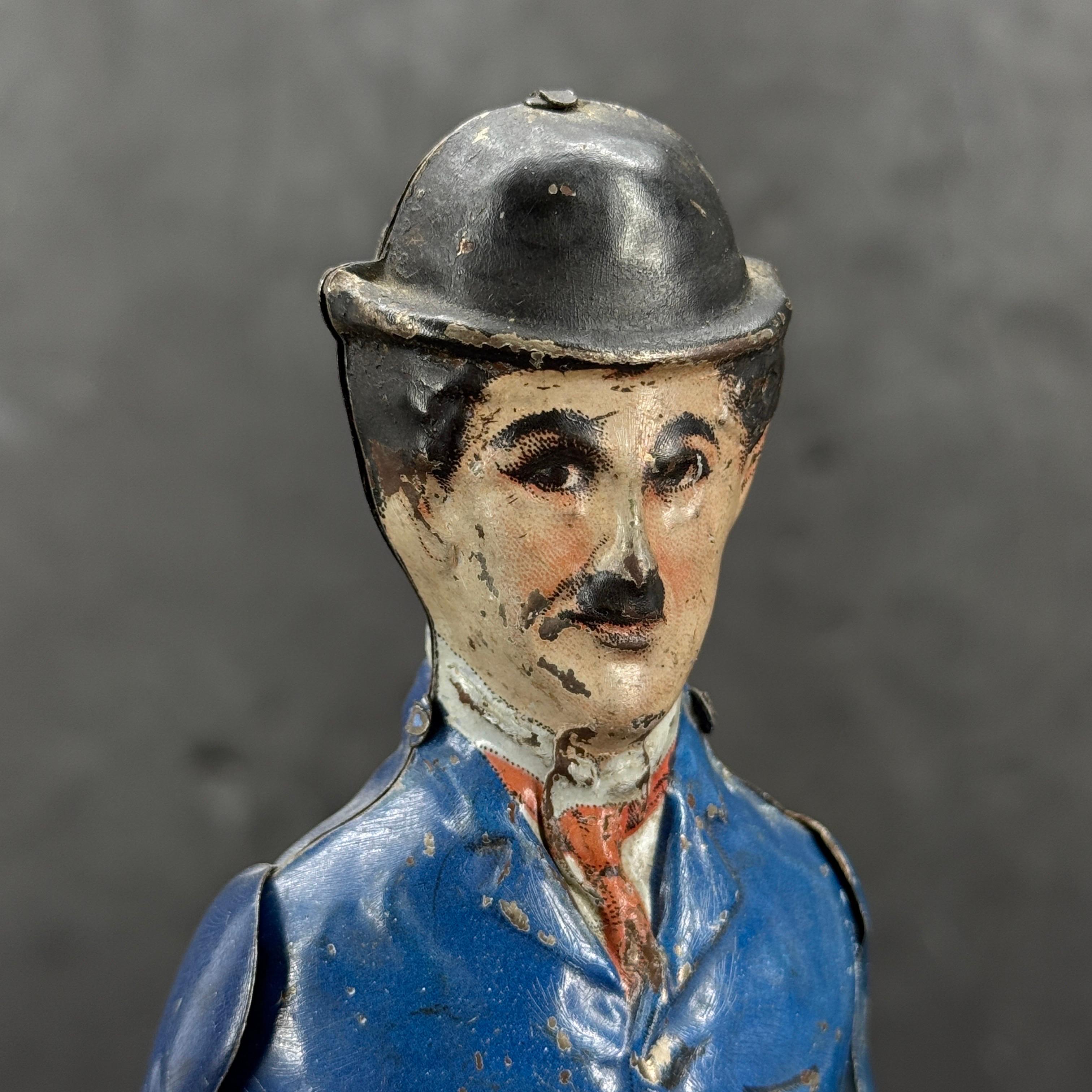Artisanat 1915 I. A. B. Charlie Chaplin Litho en fer-blanc Figurine à remonter Jouet en vente
