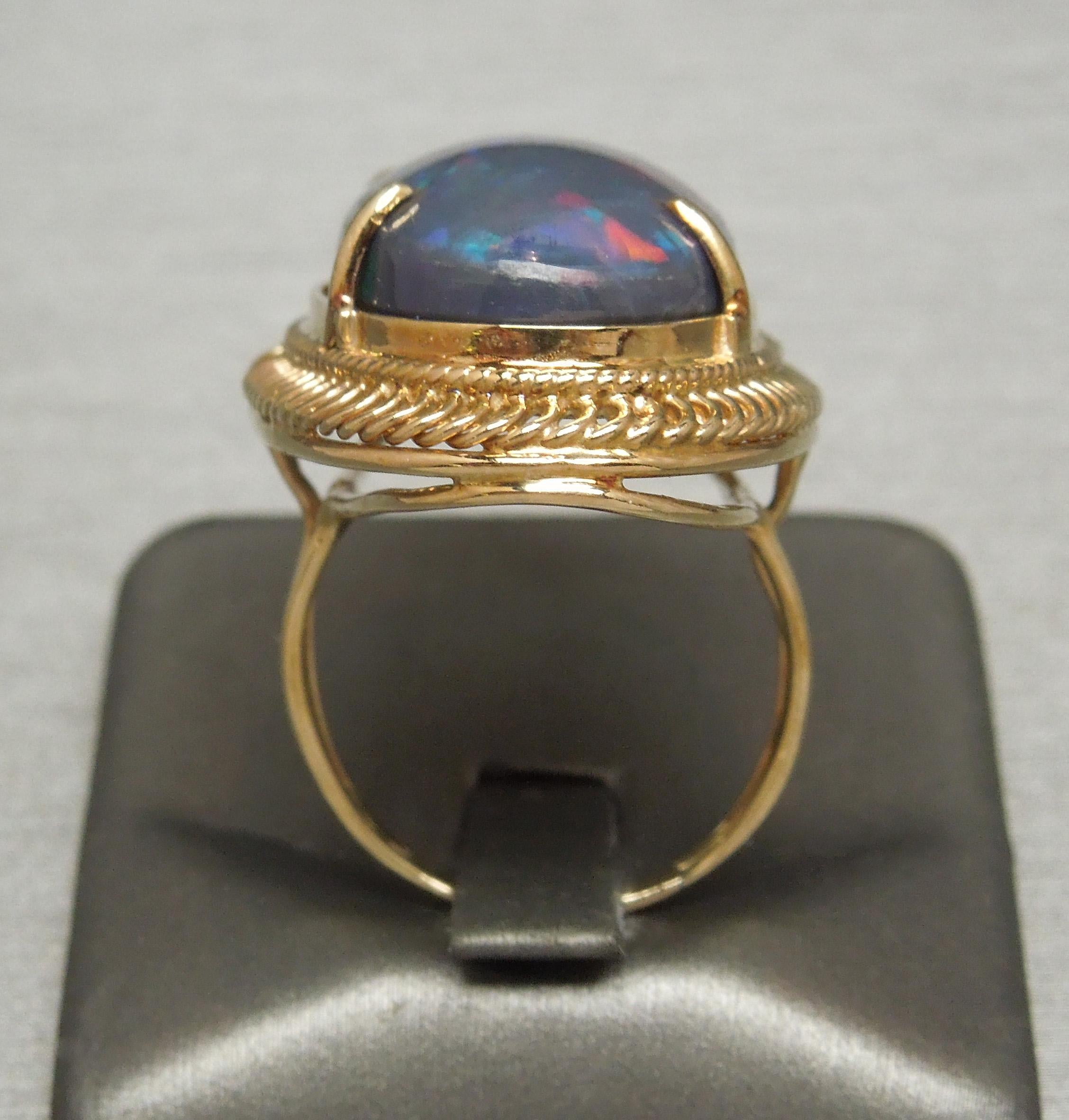 Oval Cut 19.15 Carat GIA Midnight Black Opal 18 Karat Gold Ring For Sale