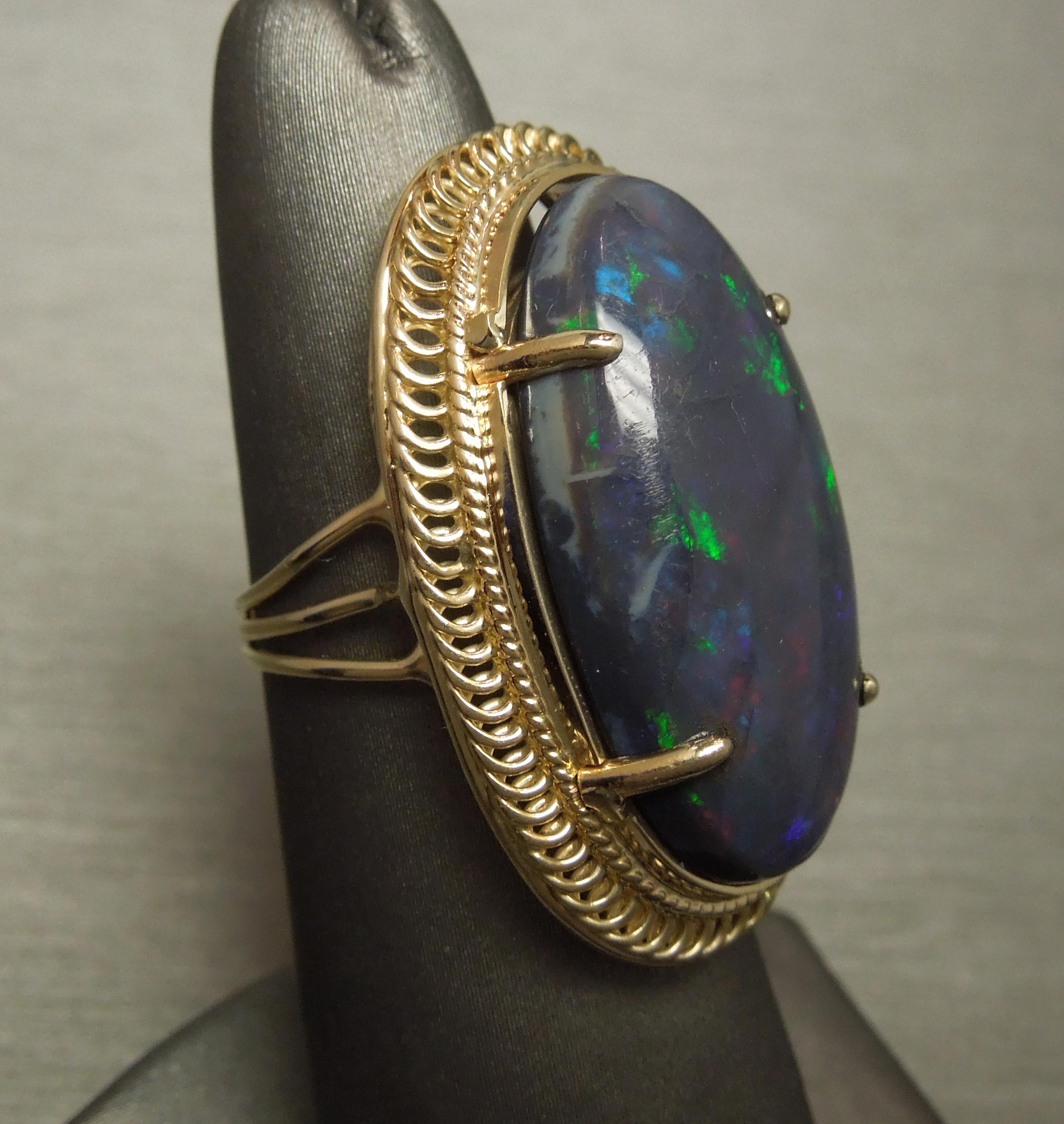 Women's 19.15 Carat GIA Midnight Black Opal 18 Karat Gold Ring For Sale