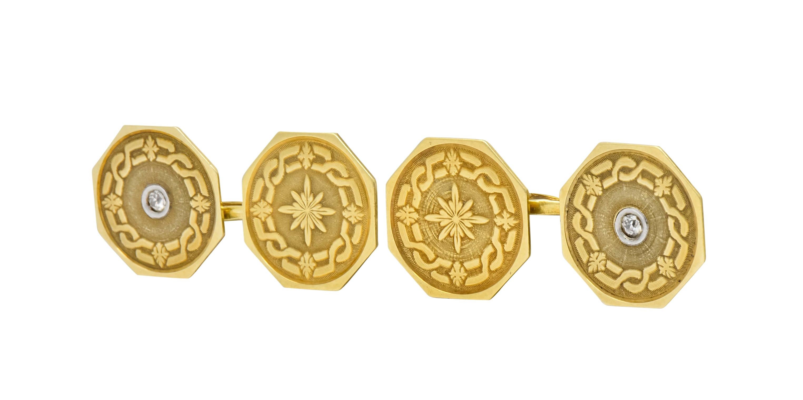 Link style cufflinks terminating as two octagonal disks with a matte gold ridged texture finish

Surrounded by a meandering Celtic knot pattern with four foliate motif stations at each cardinal point

Centering a starburst motif with bezel set old