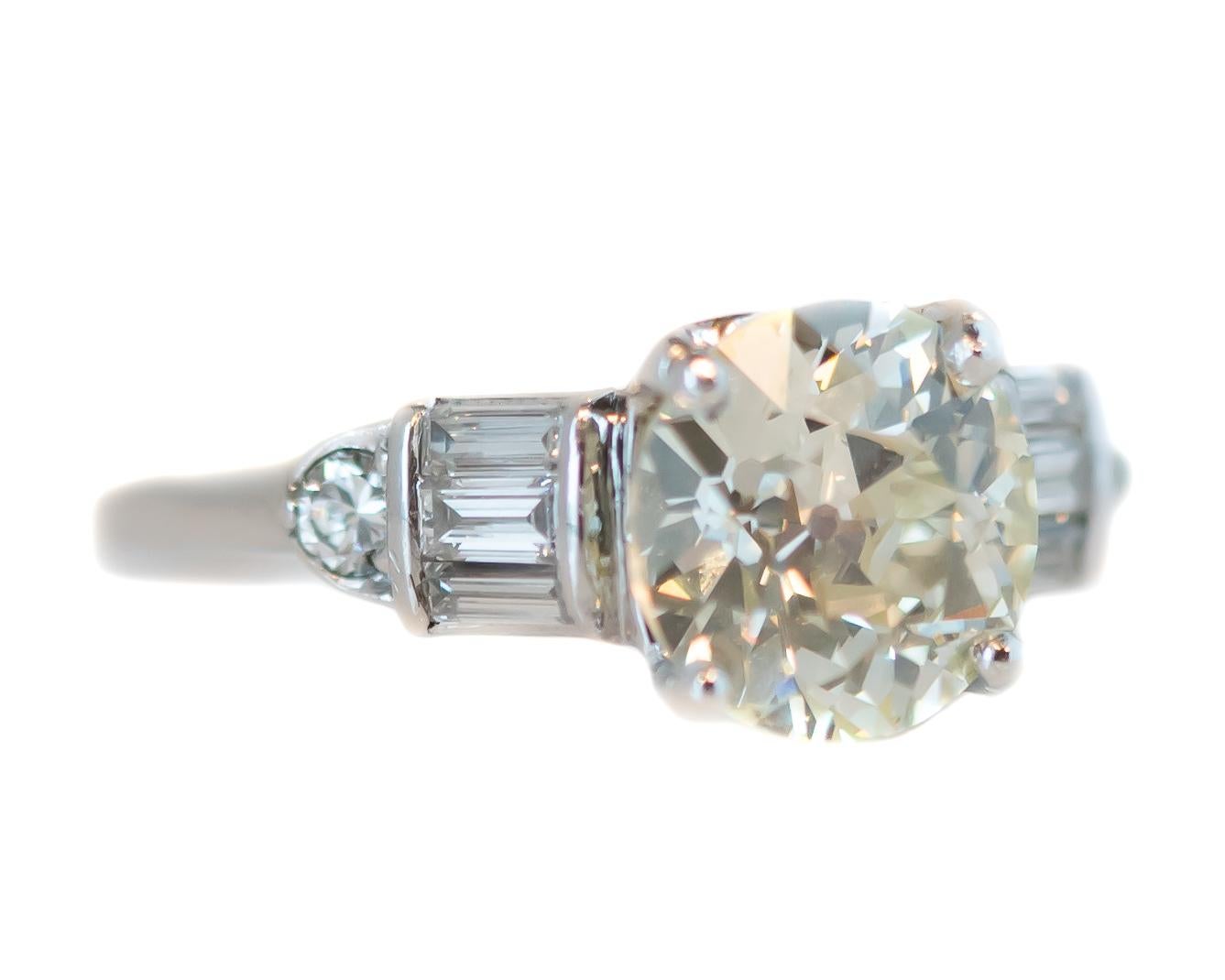 Antique Old European Round Diamond Ring - Platinum, Diamonds

Features:
1915 Old European Round Diamond Center Stone in a 1930s Platinum Setting
2.22 carat Old European Round Diamond
0.20 carat total Old European Round and Baguette Diamond Side