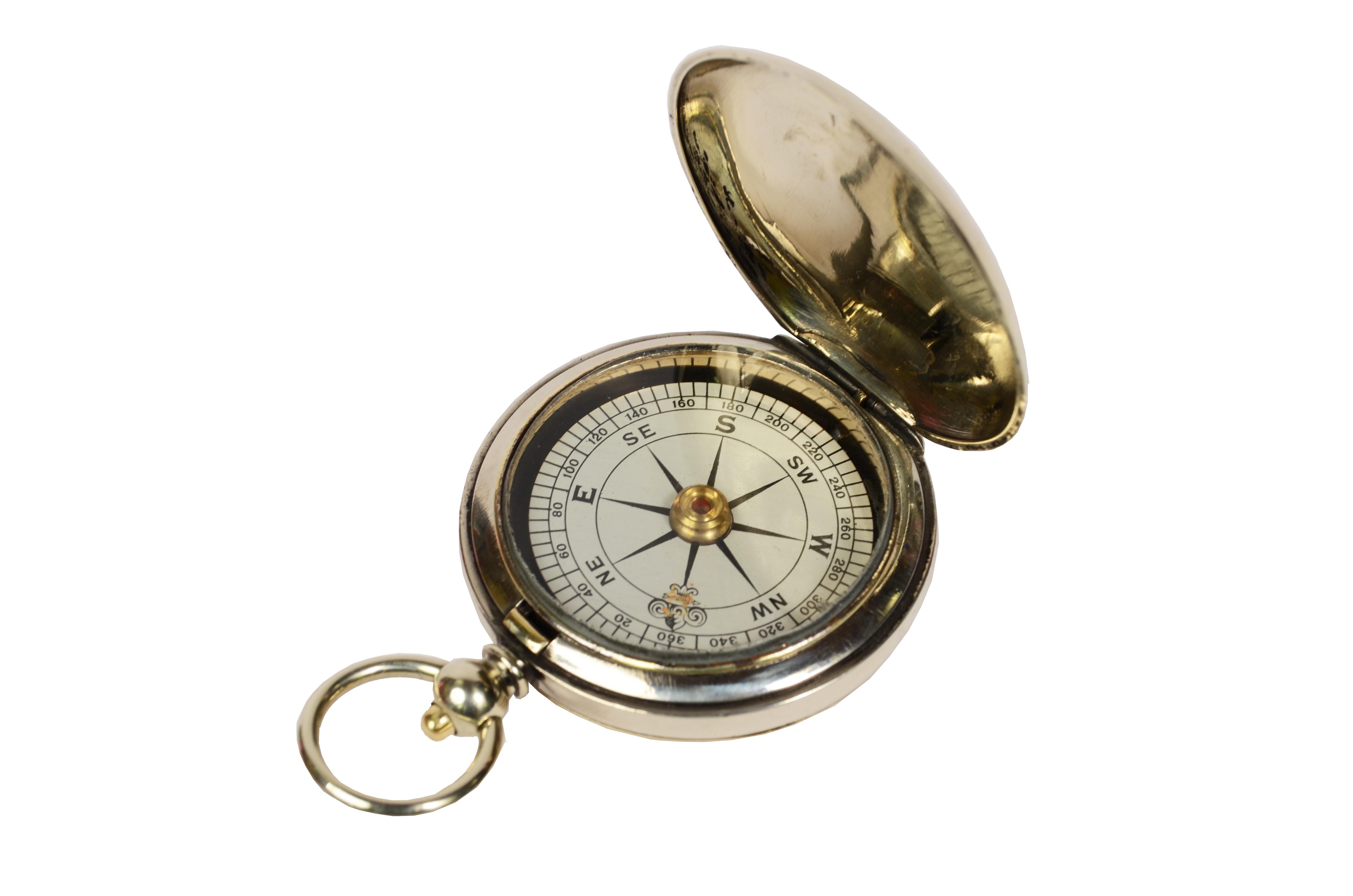 Pocket brass compass used by British aviation officers during the first World War
In the shape of a pocket watch. The compass has a snap-lock lid with release button inside the ring . 
Height-winds compass card complete with goniometric circle for