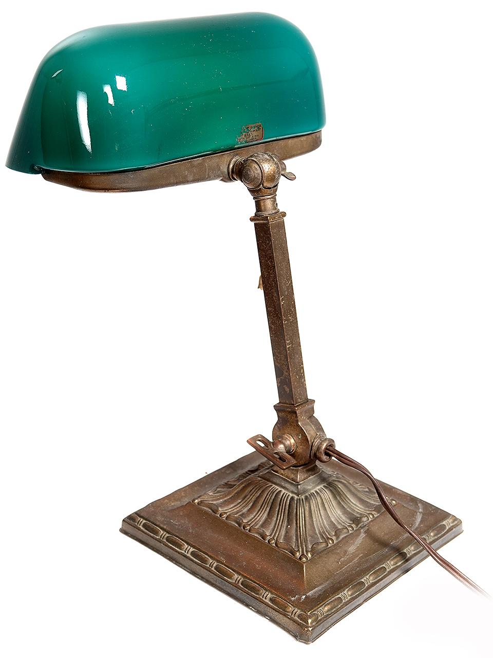 This is an original signed Emeralite table lamp. The glass is perfect and the look is simple and elegant. The base is heavy. Both the arm and shade articulate. This is a beautiful sought after table or piano lamp.