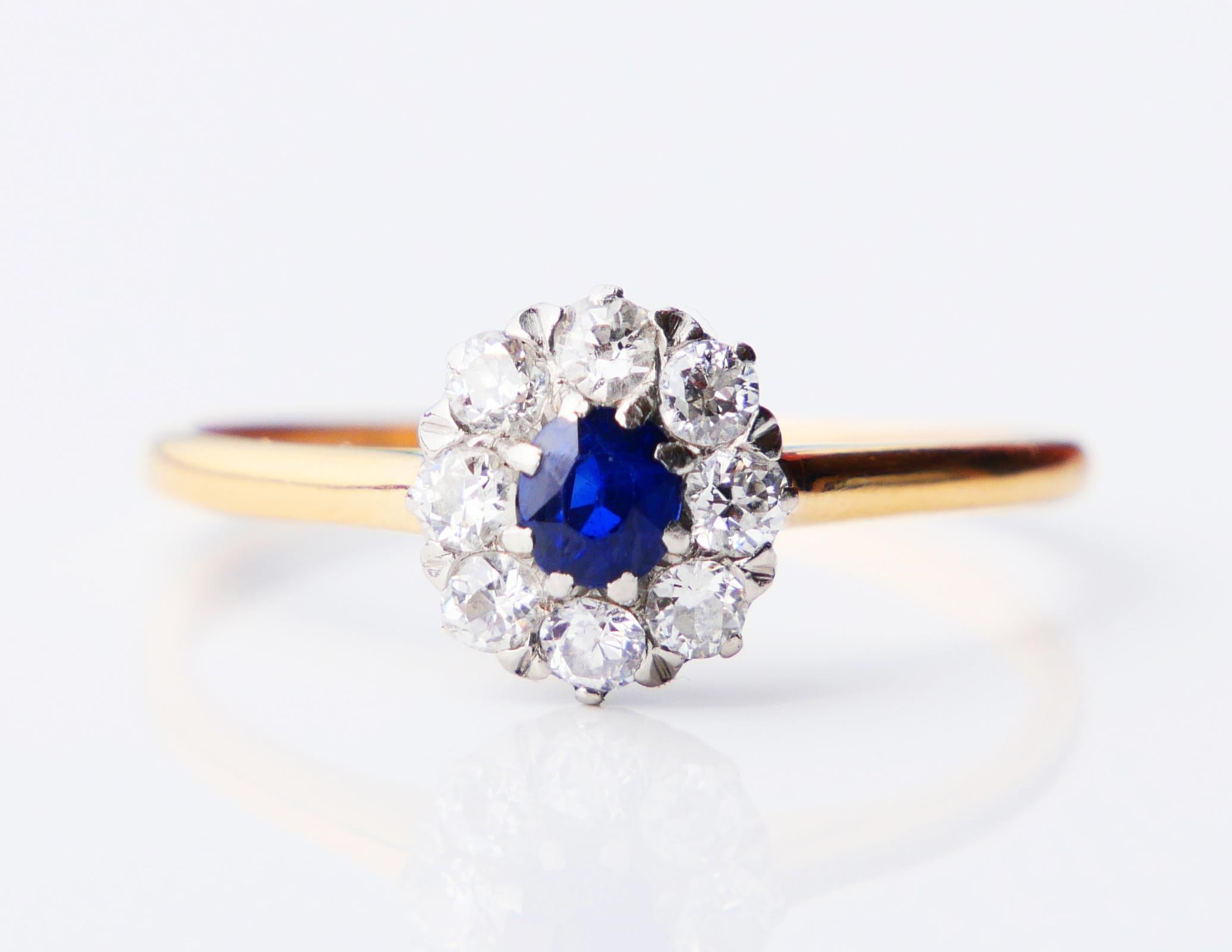 Beautiful 108-year-old Halo Ring in solid 18K Yellow Gold with natural Blue Sapphire and 8 old European cut Diamonds in Platinum settings.

Natural Sapphire of old European diamond cut, color is medium Blue demonstrates inclusions and distinctive