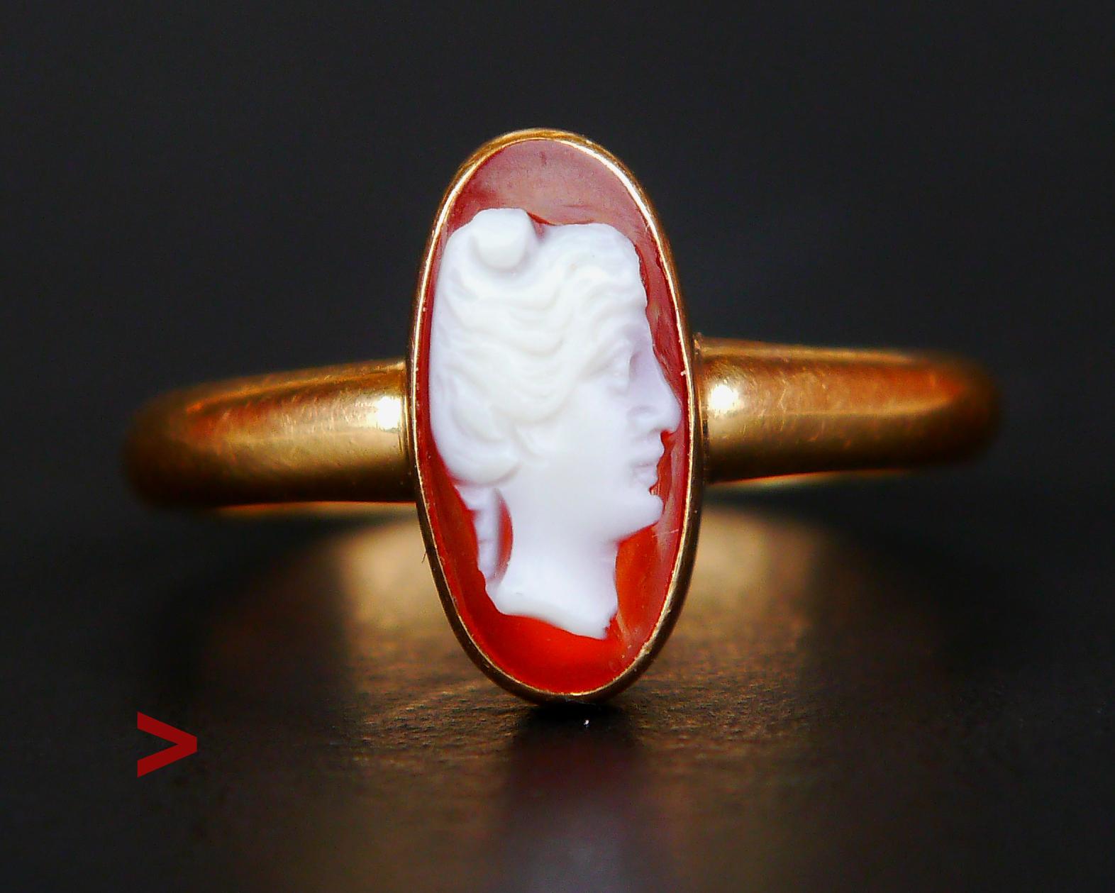 Old Swedish Ring in solid 18K Yellow Gold featuring carved female head cameo skillfully engraved on the surface of Carnelian stone, a variety of  Chalcedony with a layer of white on the surface. Hallmarked 18K &,maker is E. Mandal , Helsinborg, year